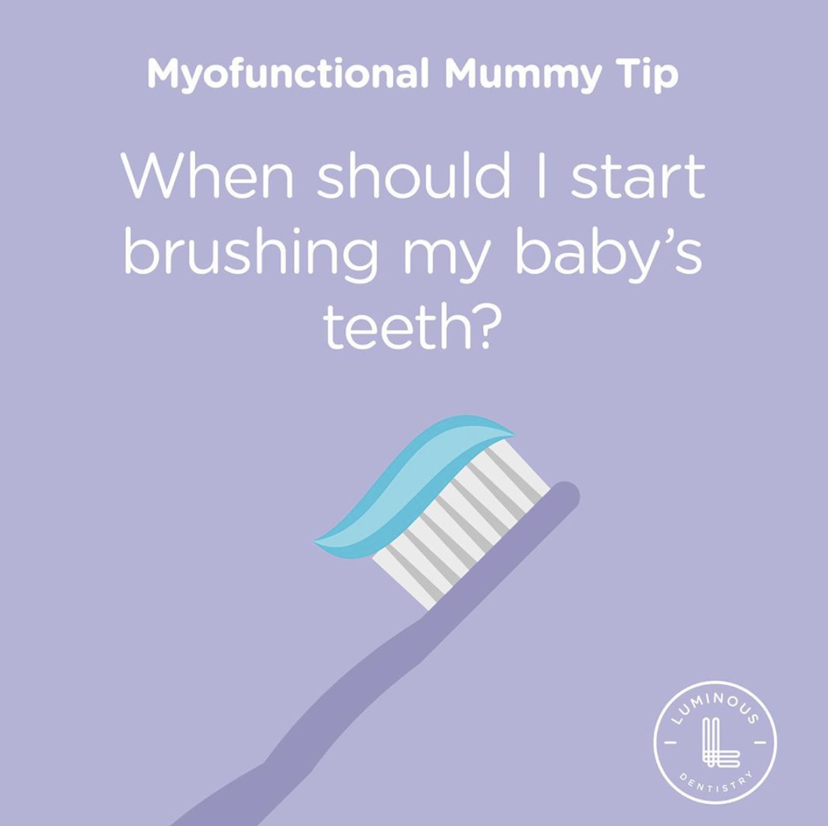 when should I start brushing my babies teeth?