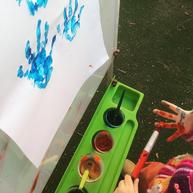 The easel was set up to invite print-making this afternoon but this child took things into her own hands (literally!) for some spontaneous hand-painting!