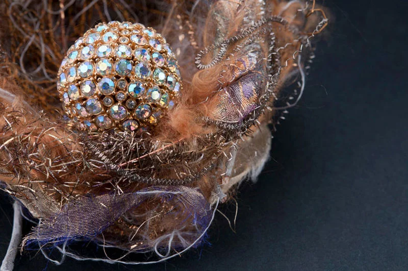 Detail. Vintage wire, threads, fabrics, with rhinestone egg.
