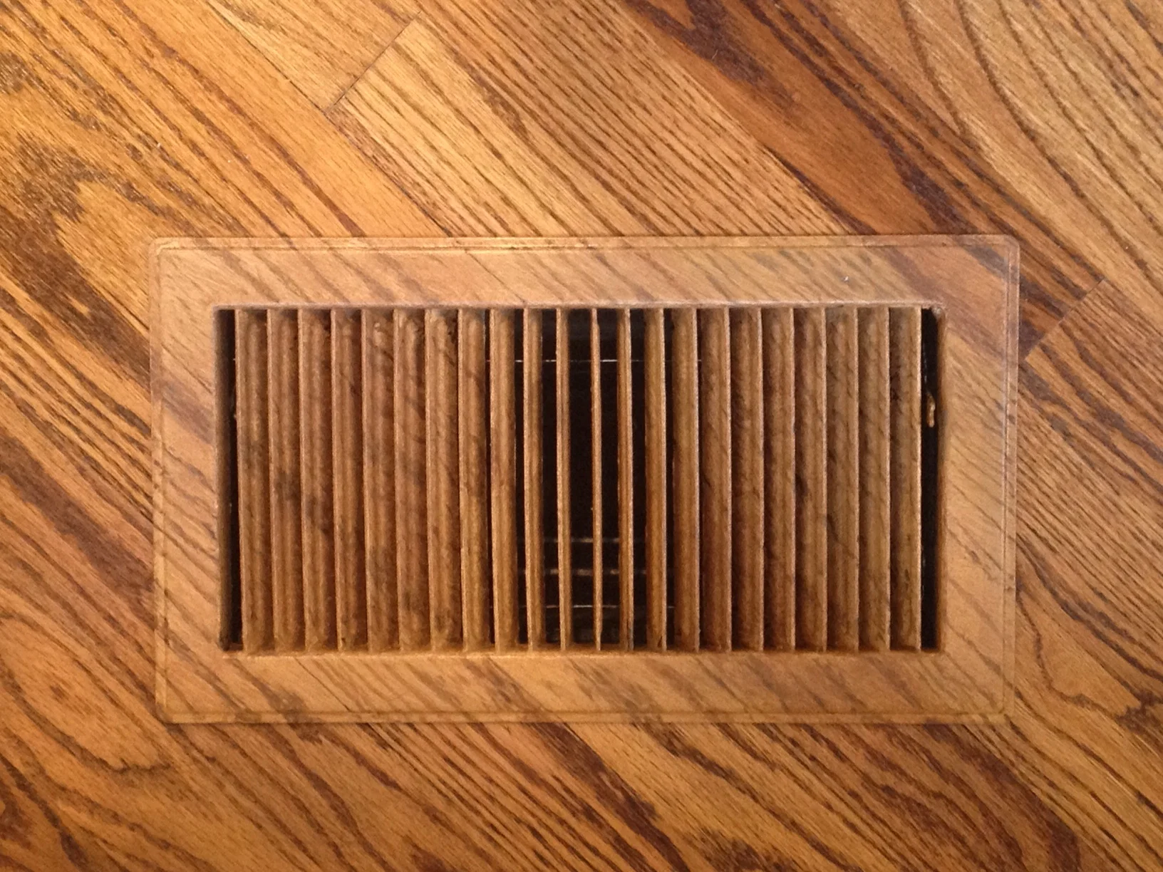  Air vent painted to match floor. 