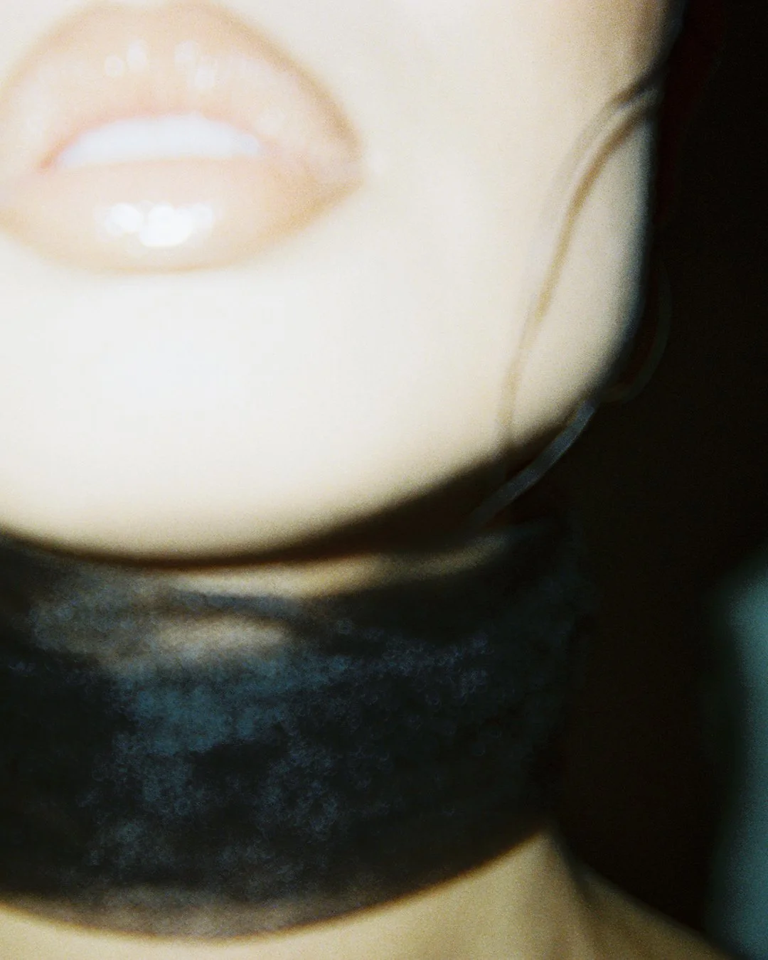 Close-up film photo of model's lips and chin by Catie Menke Wilson