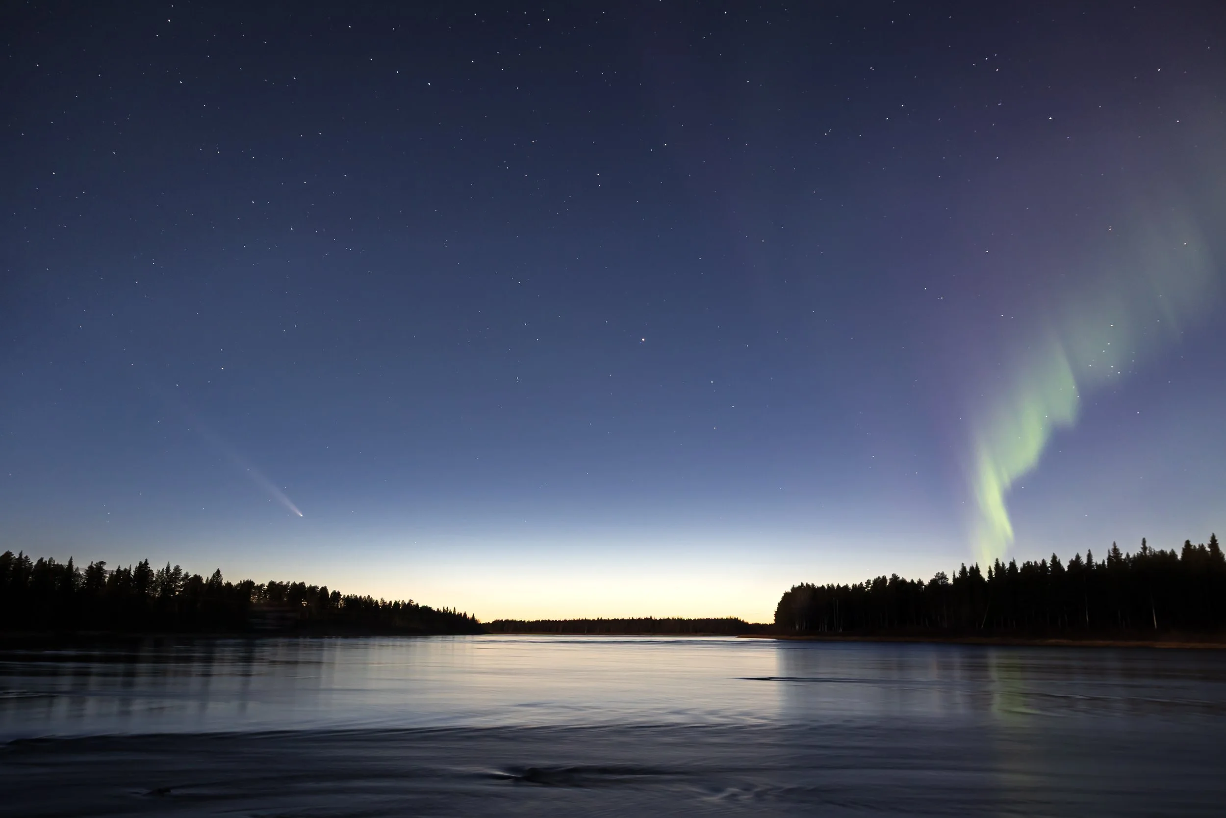 A comet and the aurora at dusk.