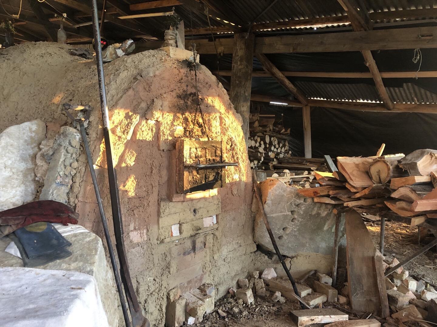 Morning light on the kiln last day cone 11flat at front