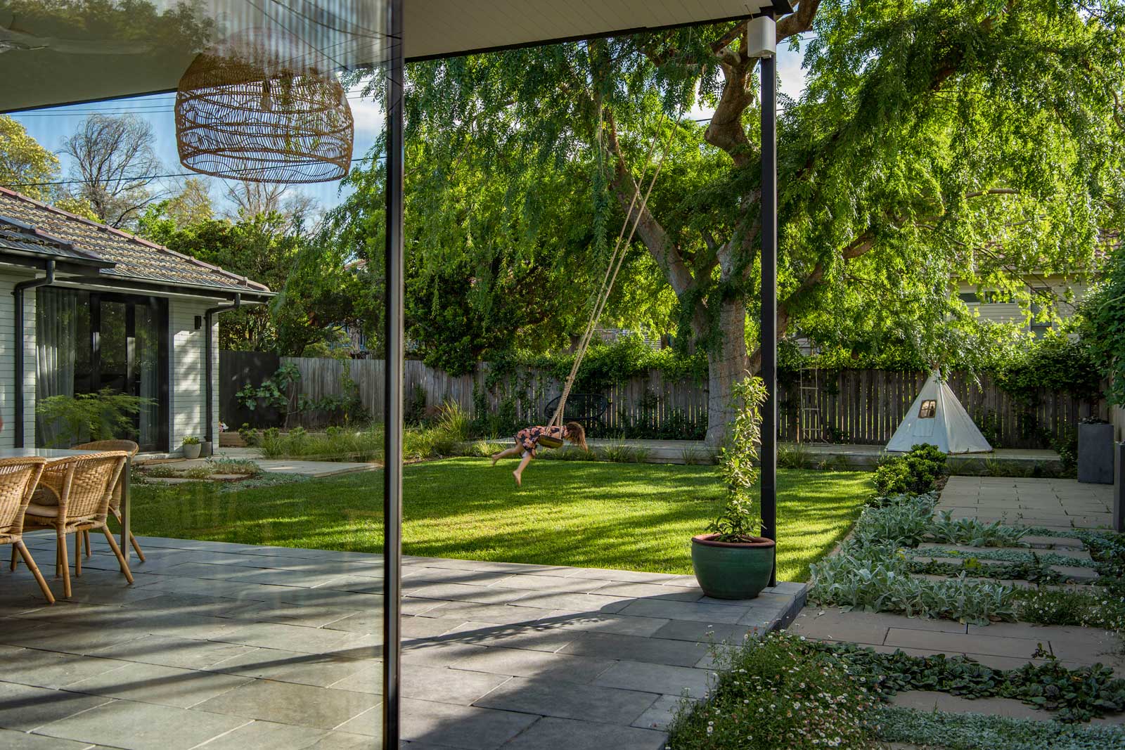 Family friendly garden, feature lawn, Chinese Elm in deck, ground cover mix through pavers | Canberra Gardens