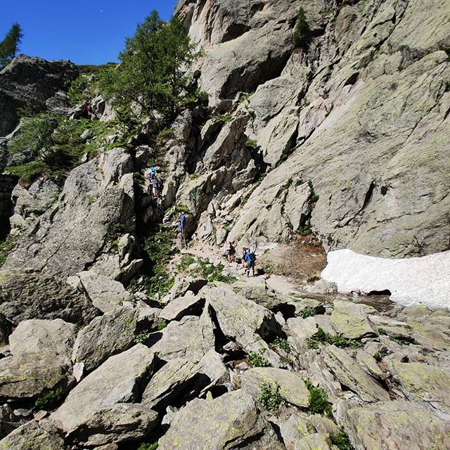 ⛈️❄️☀️TMB Trail tips for snow☀️❄️⛈️ While the heatwave is helping melt the snow, there is still plenty on high parts of the trail. Until all the snow melts, here a few risks to be aware of and tips to manage them. (1) The snow becoming icy/slippery: This will typically be if there is a cold morning/day but even in the heat of yesterday I found the compacted tracks of hikers to be slippery. Microspikes and poles are therefore recommended until the snow has cleared, especially for those that don't have the experience/confidence of hiking across snow. Just because there is a heatwave and softer snow now, doesn't mean there won't be cold days in the coming weeks making the trail with steep snow sections very challenging to cross. (2) Changing snowpack: The area where hikers step on/off snow are usually where they are most likely to post hole/sink in. When these zones are over rock piles covered in snow, post holing can be especially treacherous. Trousers/Gators can help prevent cuts and scrapes. Being aware of the danger zone, looking at the result/footsteps of past hikers, poking the snow with your pole to judge stability and treading carefully will reduce incident. If you're crossing snow over a water way (snow bridge) - same tips apply but first try to go around! (3) Swelling streams: With so much snow still around, hot weather increases the amount of melt water being drained via the stream network. If coupled with storms delivering large amounts of rain to catchment areas, streams can rapidly rise and also cause landslides. You've got an increased chance of getting wet feet crossing streams on hot days 😋 but be especially vigilant of going near/crossing streams during storms. 📸 Showing change over the last few weeks;
1/2 - ladders Aiguillette d'Argentiére 26.06/05.06
3/4 - on approach to Plan Praz 26.06/05.06
5/6 - on way to Col du Brévent 26.06/05.06
7/8 - Col du Bonhomme to Col de la Croix 26.06/06.06
9 - Col du Brévent 26.06
10 - Ladders near Le Brévent 26.06
#tourdumontblanc