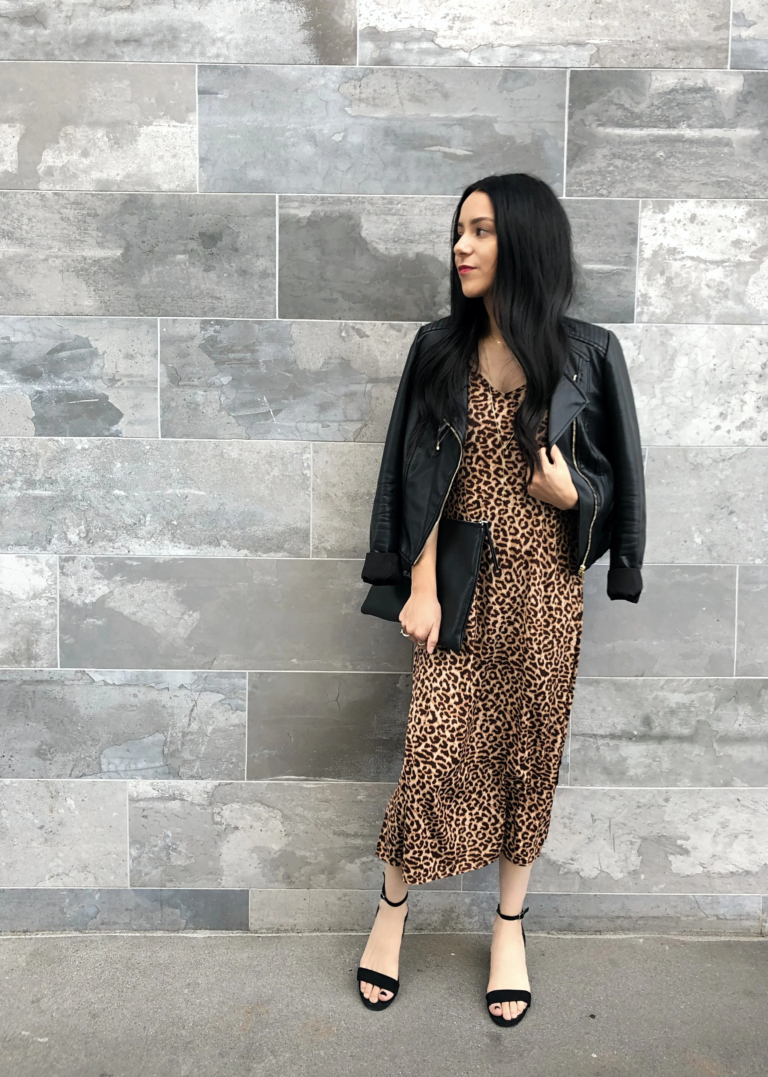 Jacket: any black leather jacket will work, just make sure it’s not too stiff or bulky on you… cropped lengths work best Shoes: Steve Madden Irenee Sandal Bag: Balenciaga Black Logo Zip Pouch