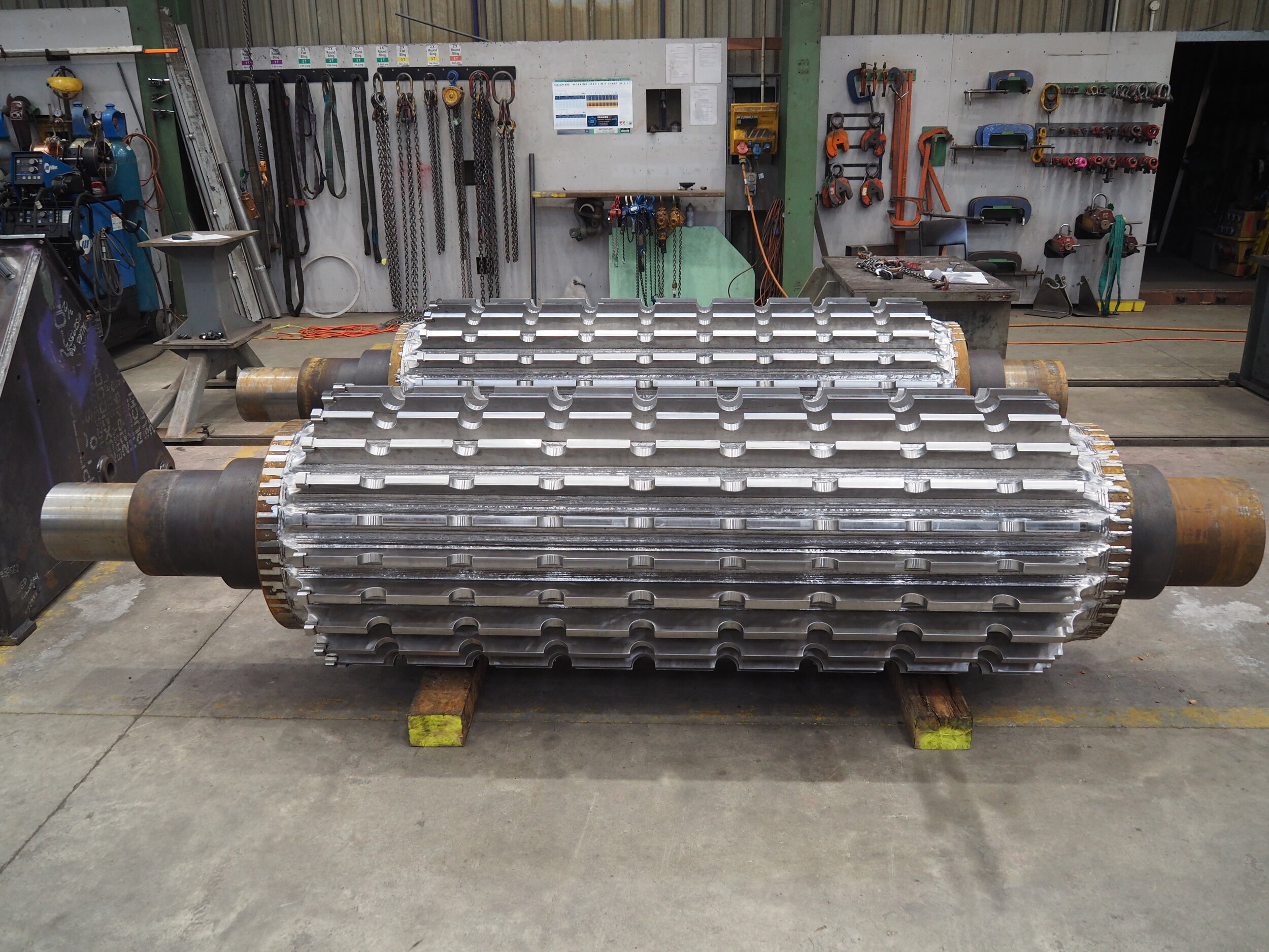   Part of a larger and complex manufacturing project, these dewatering rolls are for use in a pulp and paper plant 