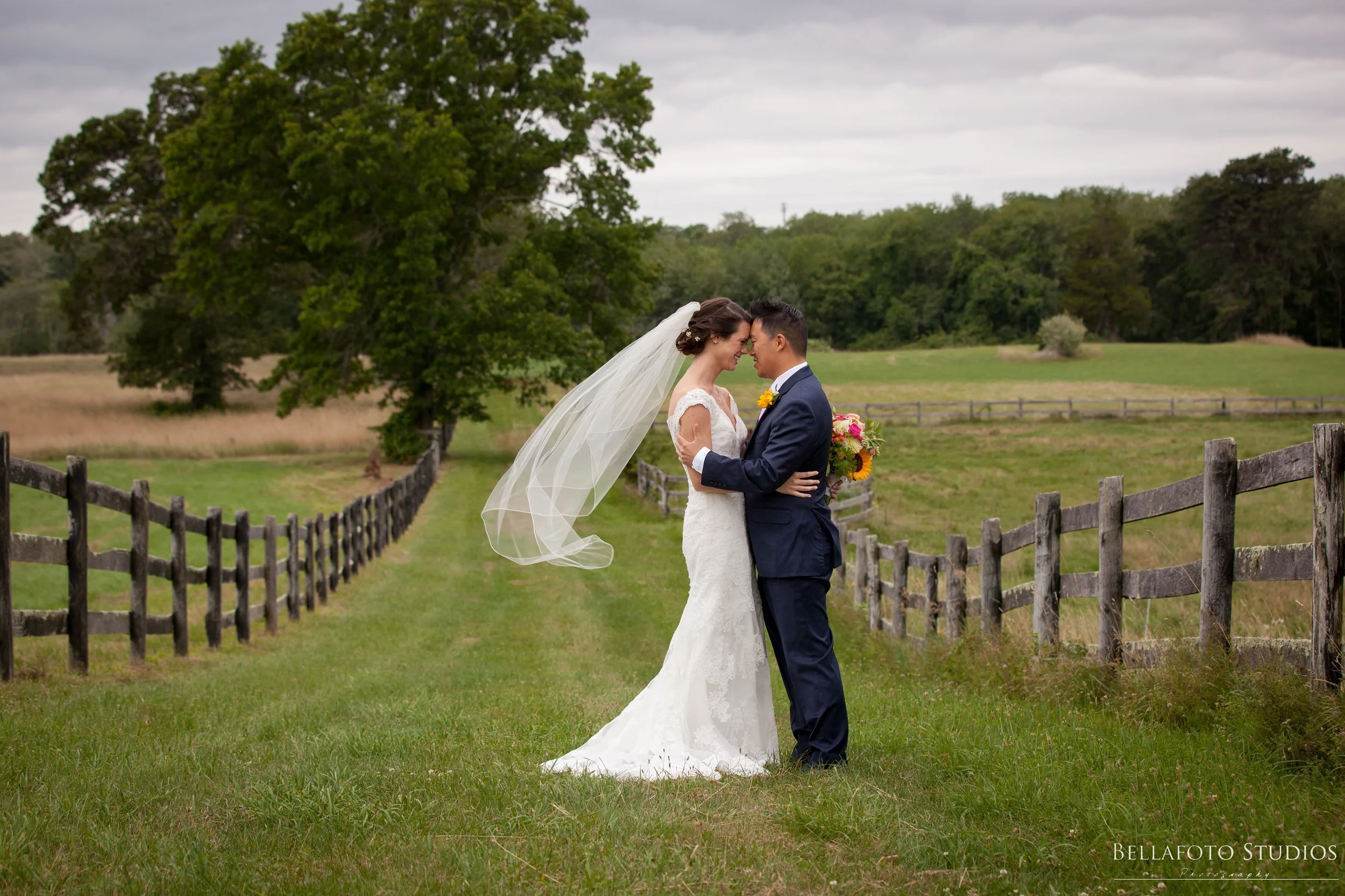 bride-groom-veil-trees-field.jpg