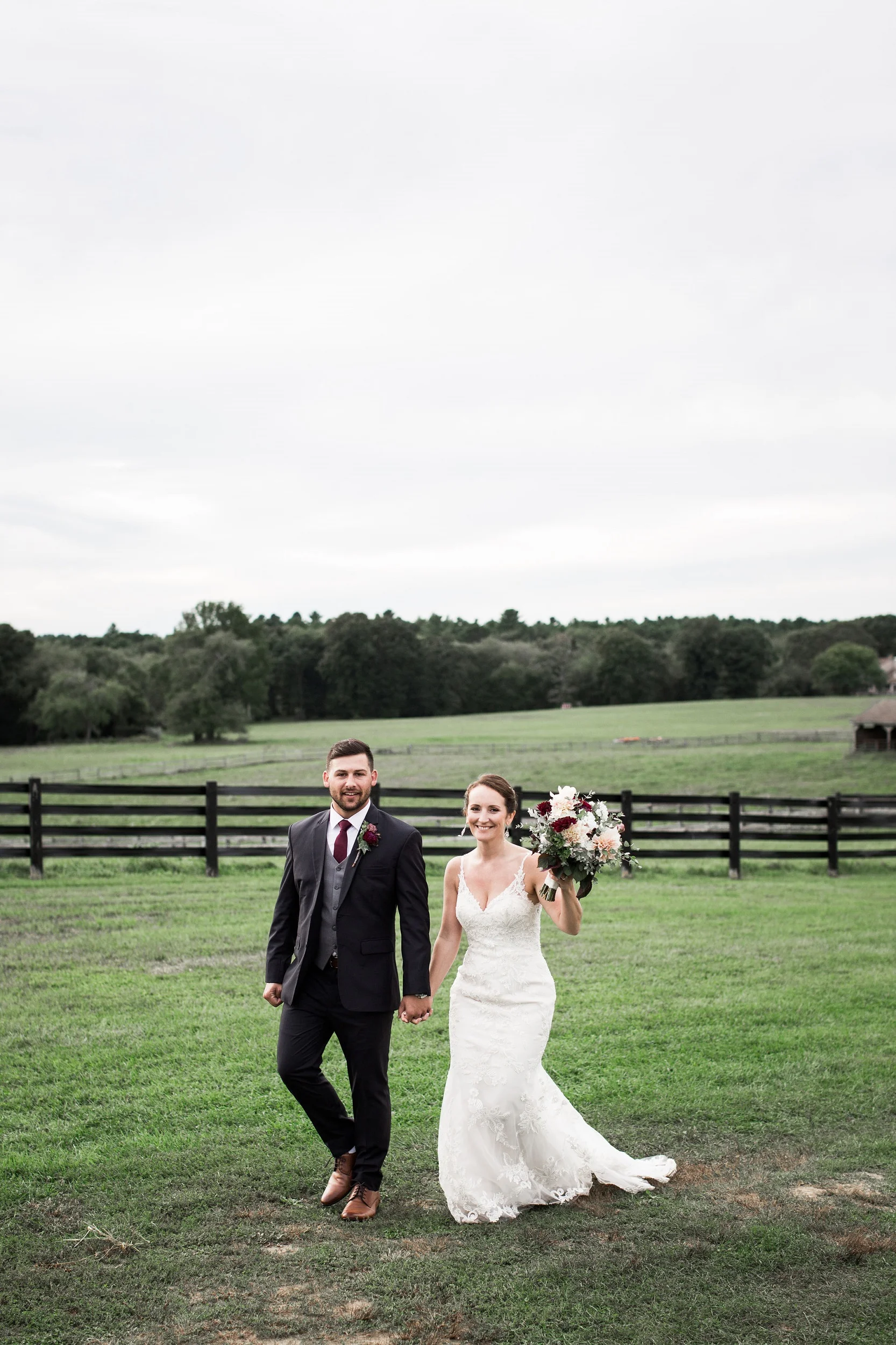 bride.groom.bouquet.field.jpg
