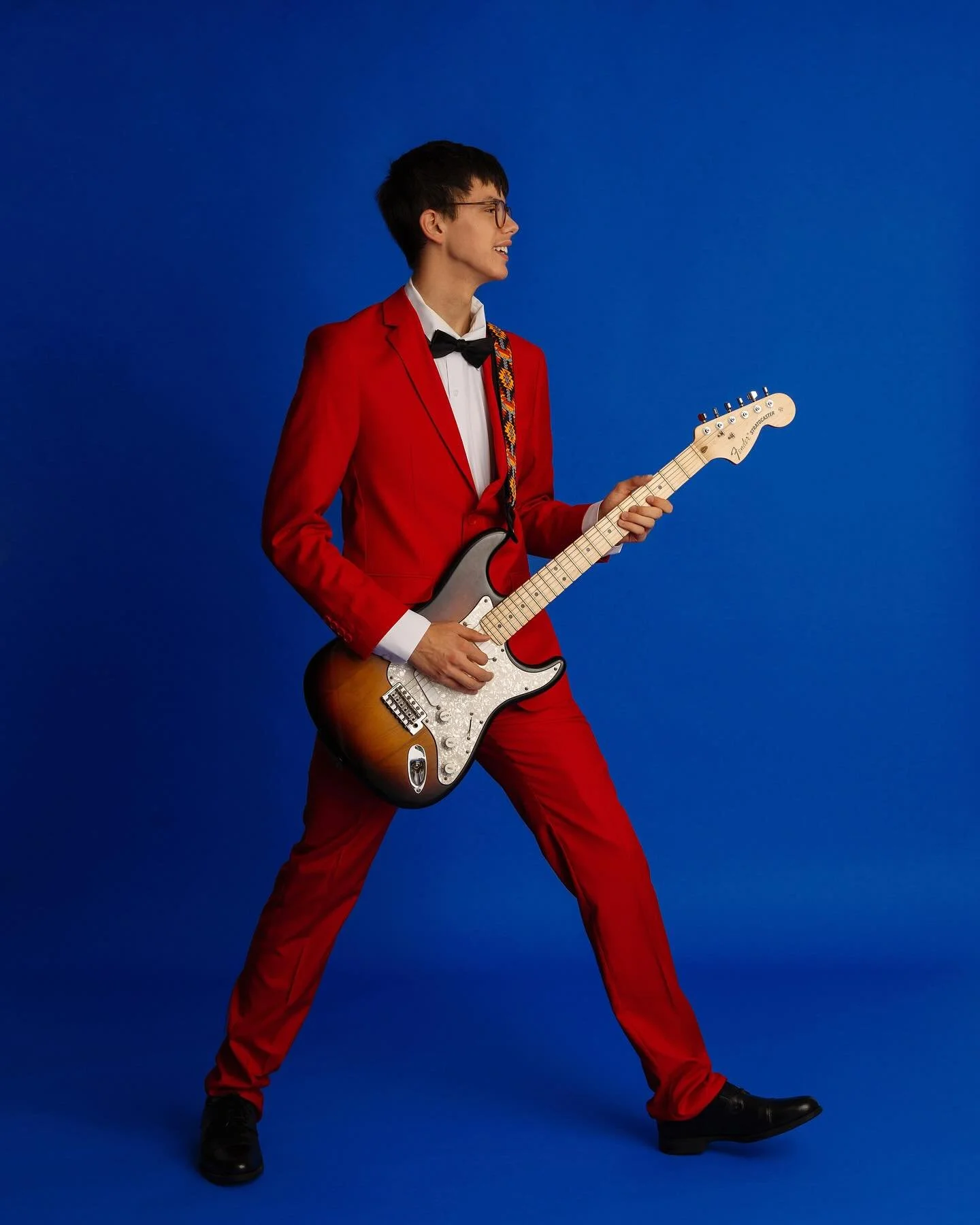 Ashton - love of the color red and music kind of vibe for his senior photos. #classof2026