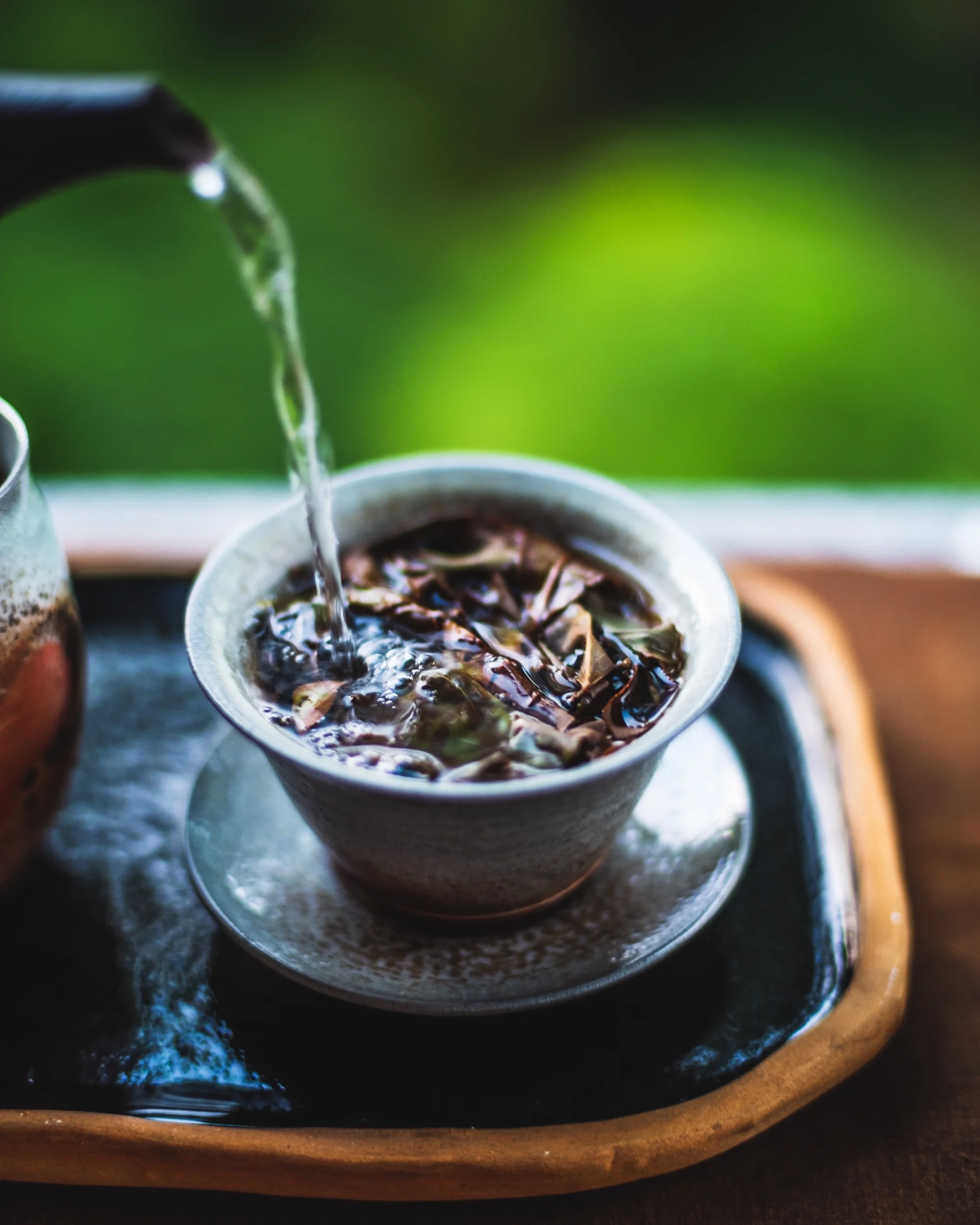 Pushing the tea by pouring almost boiling water over. It