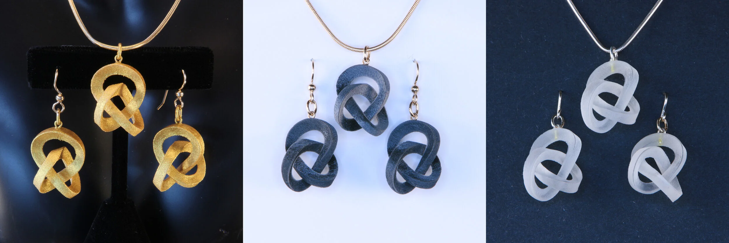 CIRCO Wearable Sculptures in Gold Dipped, Sable and Alabaster.