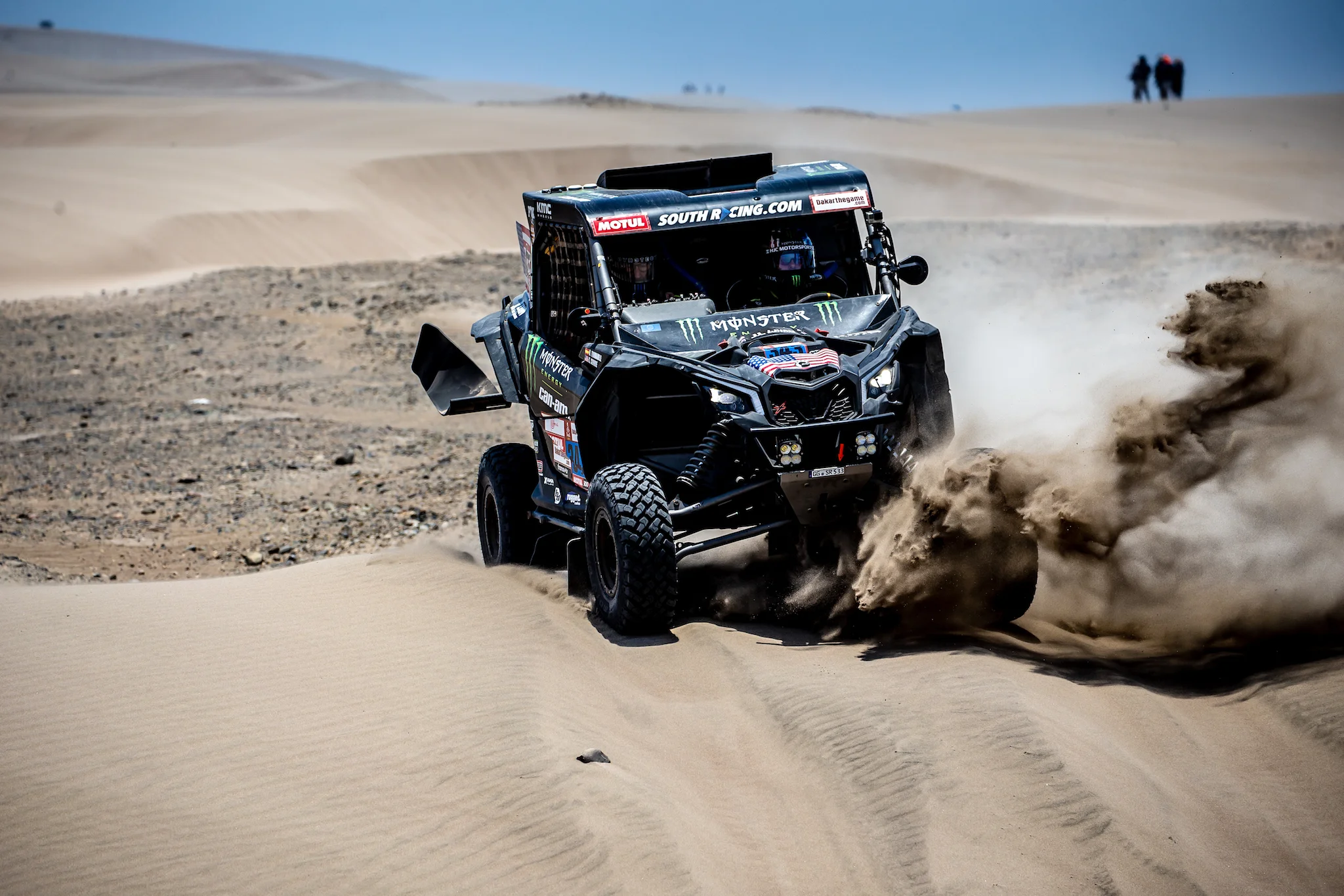 Pushing through a sand berm.