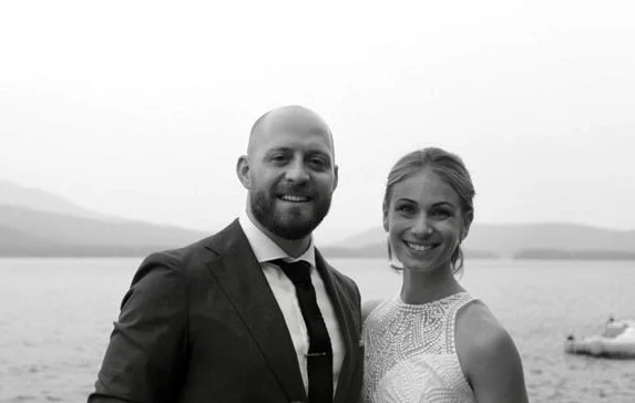 Brian Lipsett and his wife, Jenna, in a portrait featured on the Oakway Financial About page.