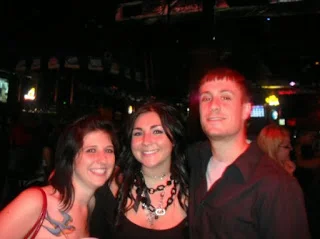 That actual night. I'm in the center, she's on the left. Let's read her soul through her face. Does she have regrets? Does she wish she'd never seen me? Is she so happy I invited myself? What do you think?