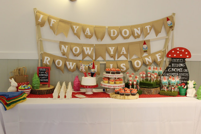Red chalkboard, red & white cake stand, and pink & green gnomes: Target bargain section Toadstool chalkboard: Streamline via Zulily Paintable Gnome bank favors: Oriental Trading Gnome Hats: Oriental Trading Mushroom topper favors: Oriental Trading