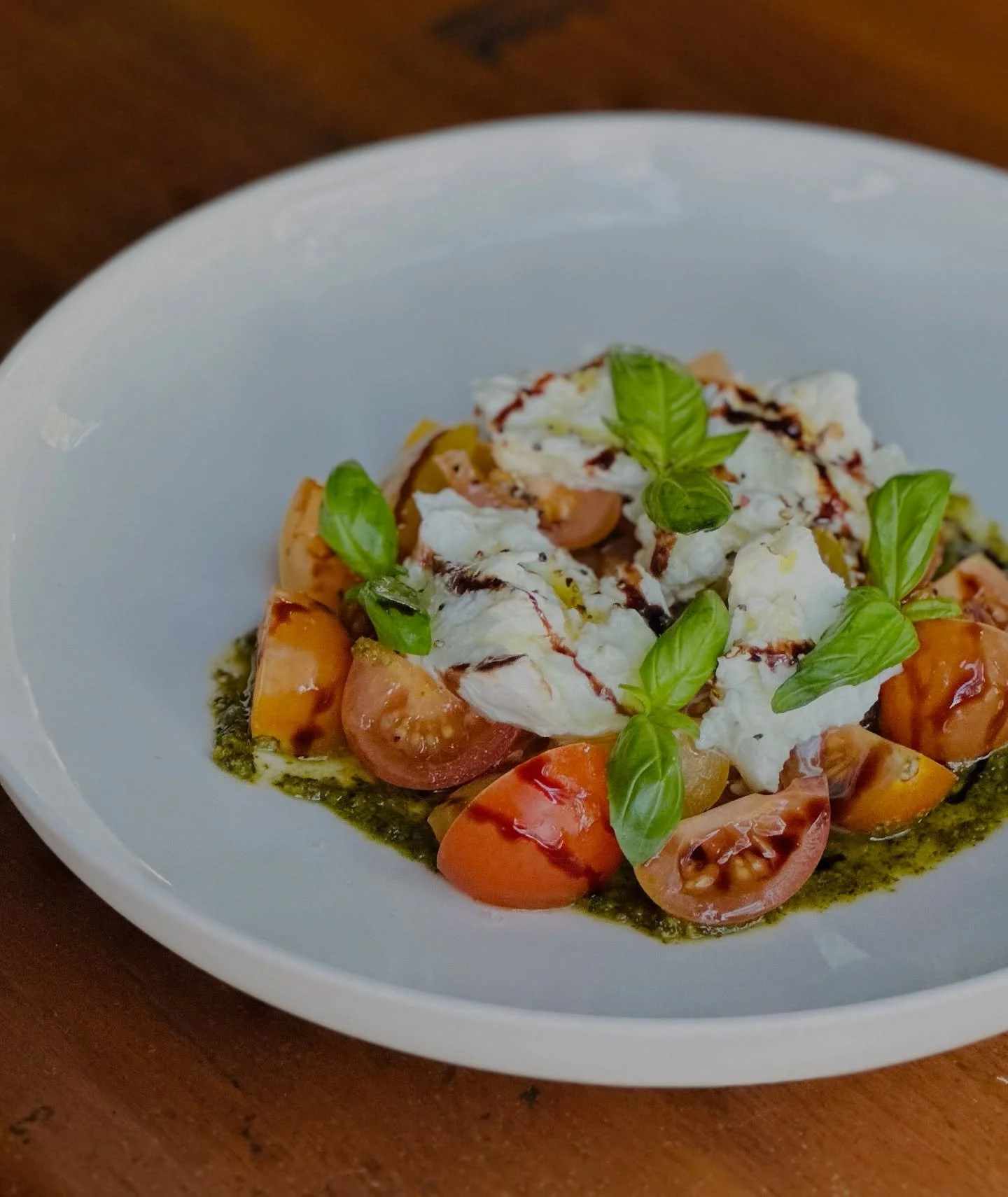 Keeping winter fresh with our Caprese Salad- tomato, buffalo mozzarella, pistachio pesto, aged balsamic 🍃