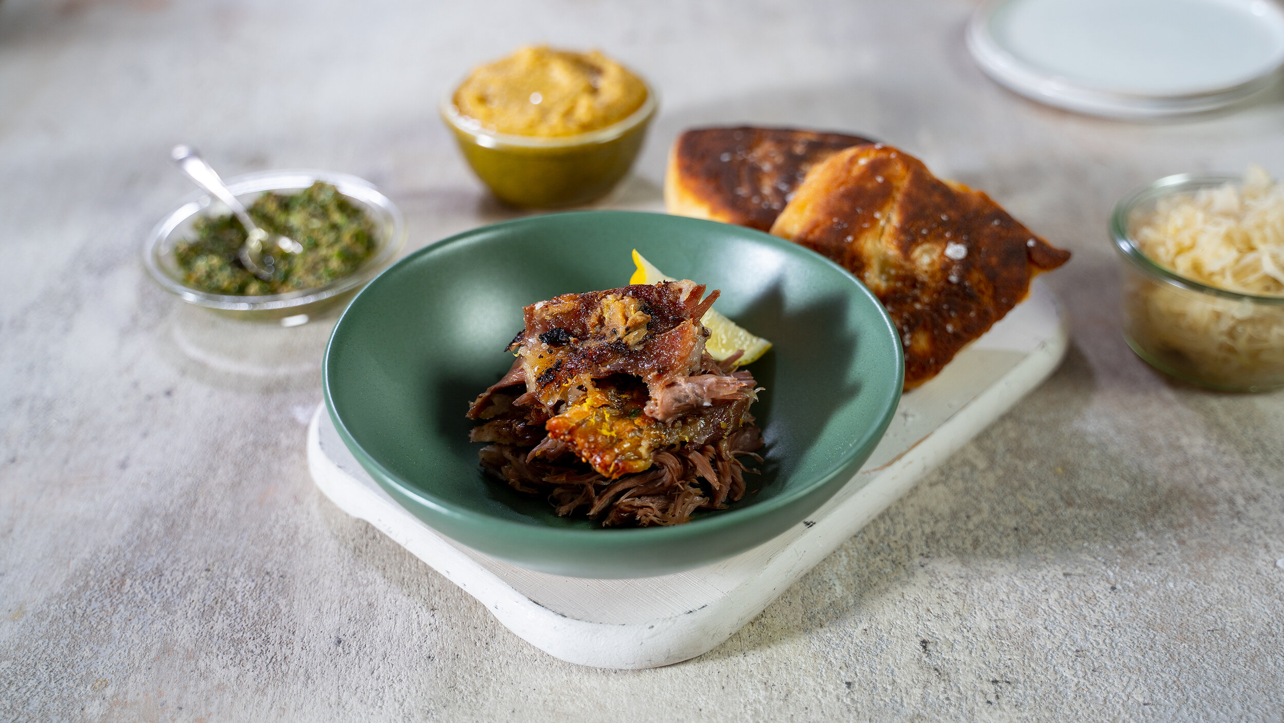 Slow cooked Lamb shoulder, Flatbreads, condiments