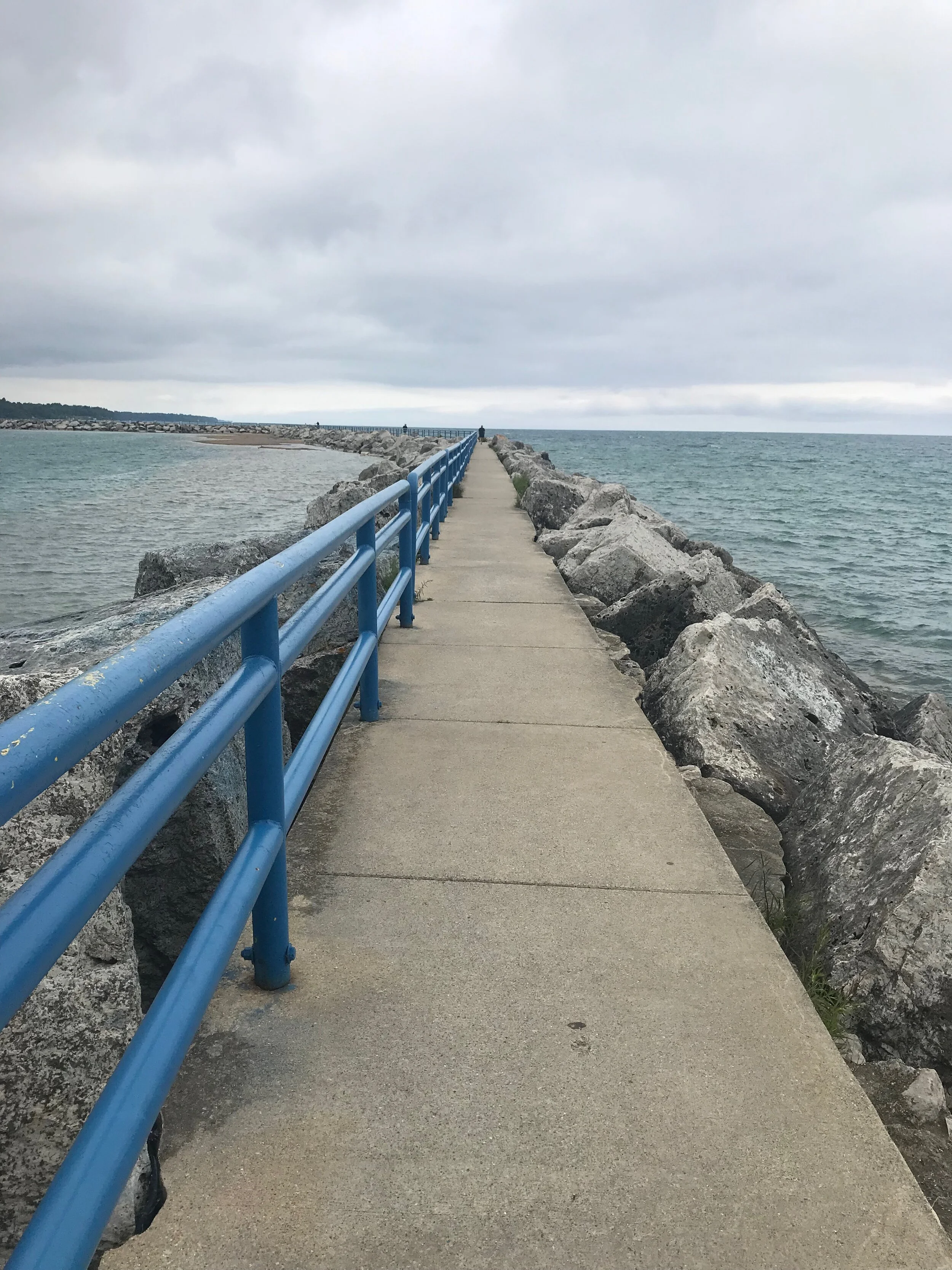 Nice long walk out across the rocks in the wind and waves hitting the rocks