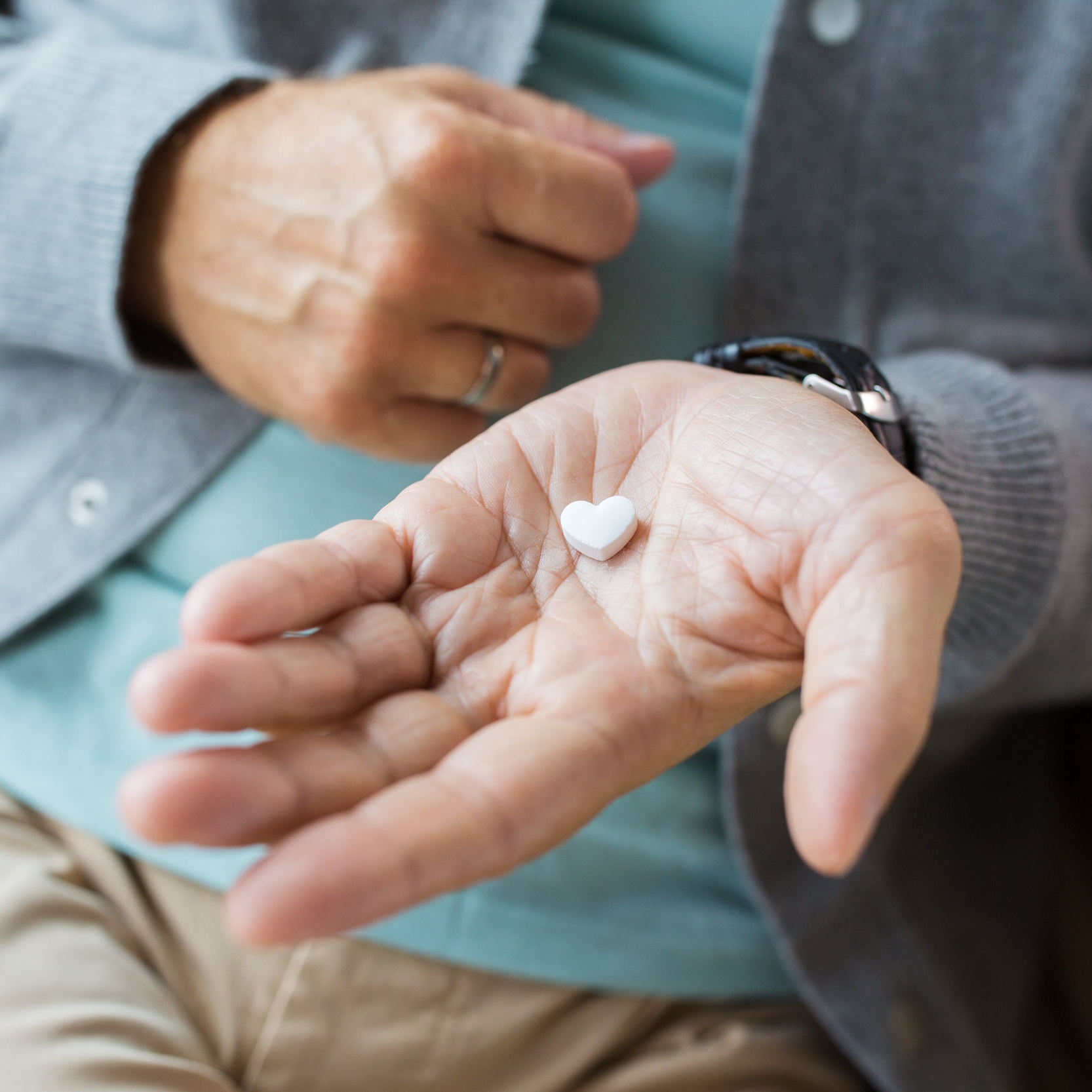 close-up-of-senior-man-hand-with-heart-shaped-P9982E4.jpg