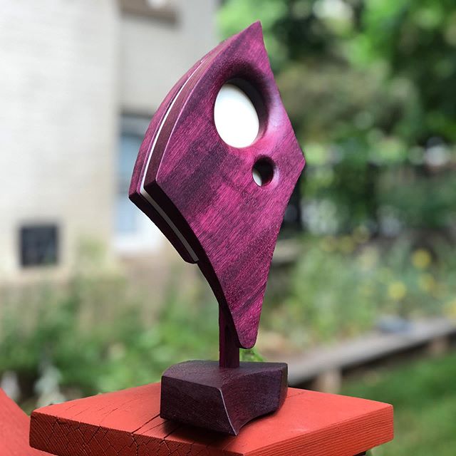 AMMA Luminaire in Purpleheart.  Finally.  The design originally called for purpleheart but the wood is tricky to mill and carve. It fractures easily and it took a little while to nail down the proper tooling. 
This, and the others are available on ou