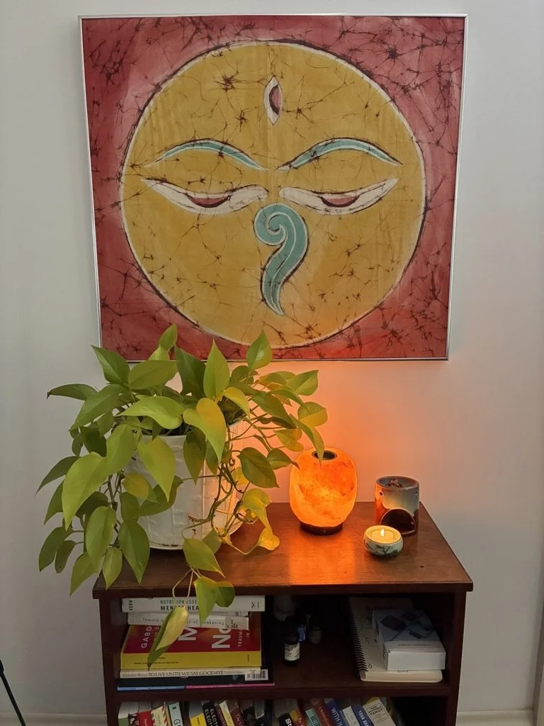 Buddha-eyes painting above a pothos and salt lamp in the office of Bren Seed, a therapist for artists near Charlottesville
