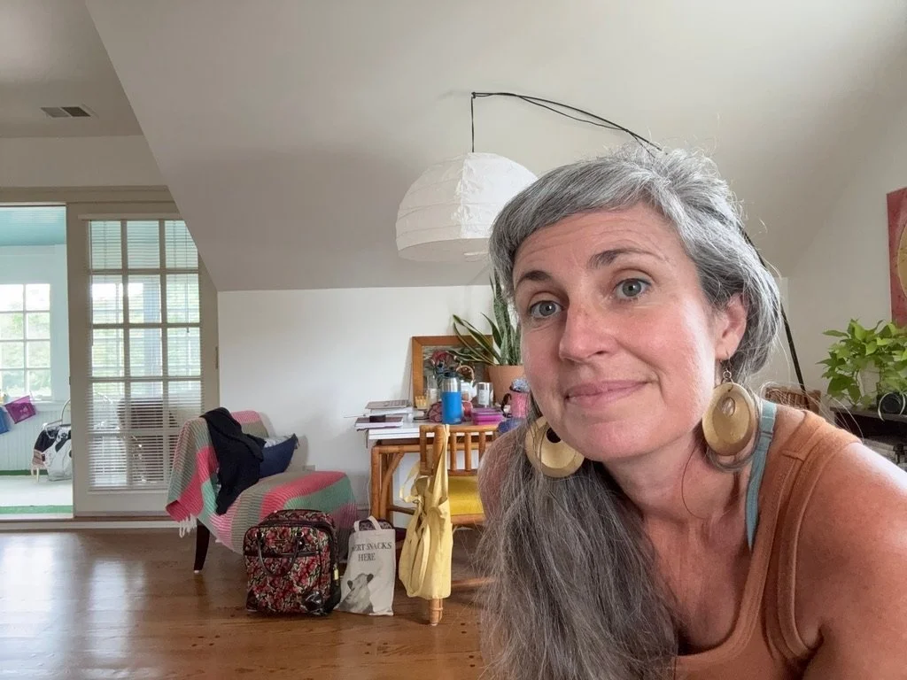 Bren Seed, LPC, grief therapist and KAP therapist, smiling in her therapy office in Virginia