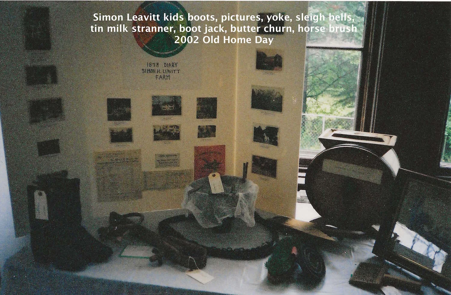 Simon Leavitt - kids boots, pictures, yoke, sleigh bells, tin milk strainer, boot jack, butter churn, horse brush - 2002 Old Home Day