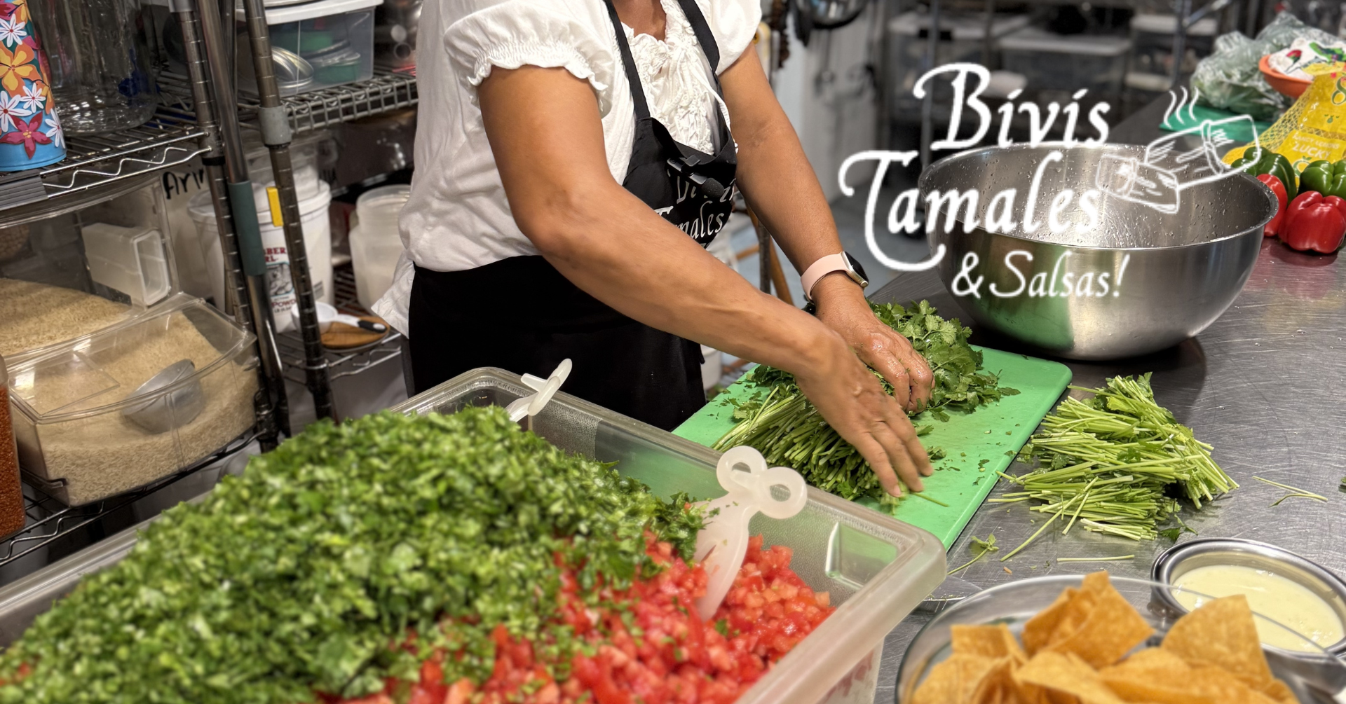 Bivi prepares fresh cilantro on a cutting board.