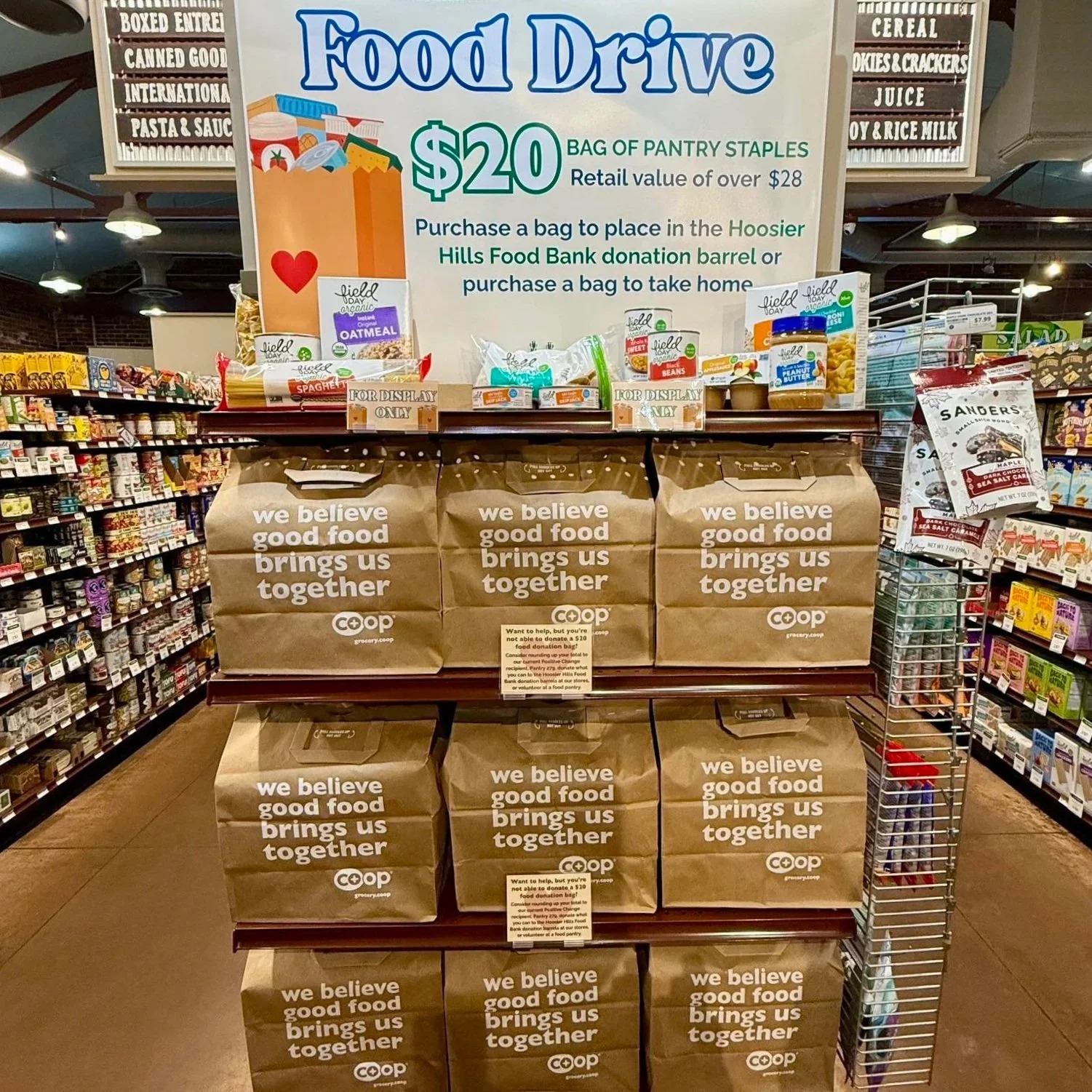 Shelf with food drive pantry staples bags at our Near West Store