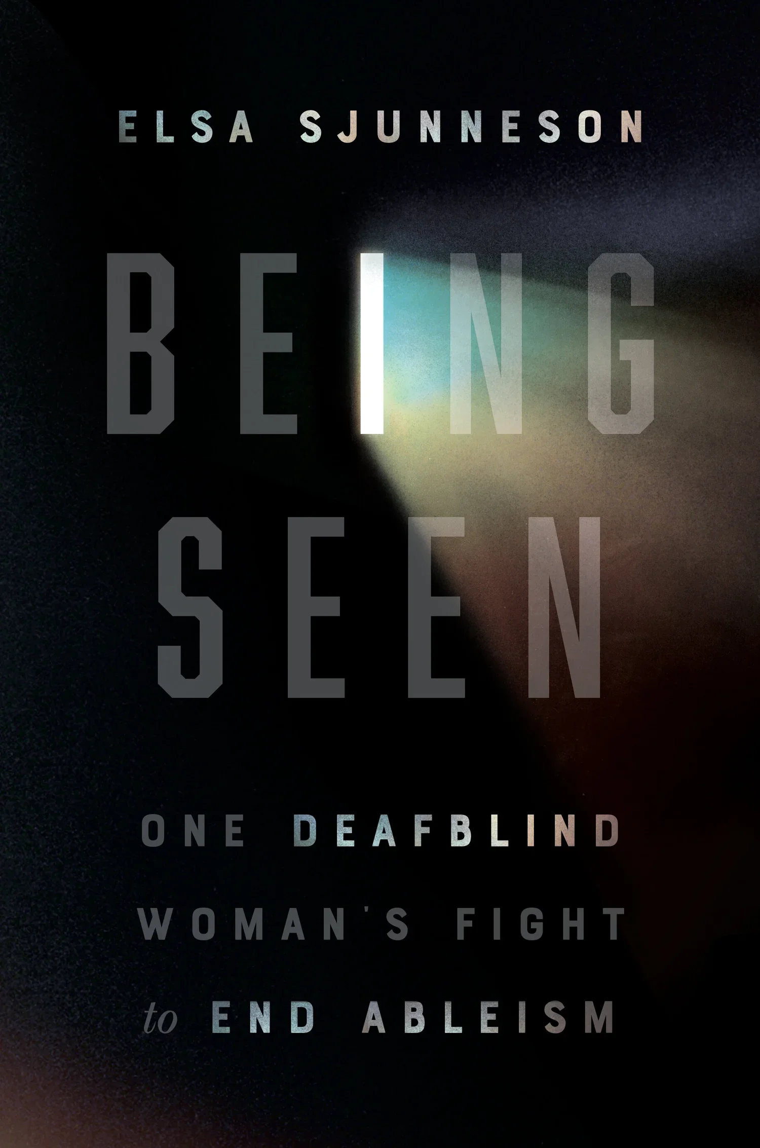 Cover of Being Seen by Elsa Sjunneson, with the title text over a dark, blurred close-up image.