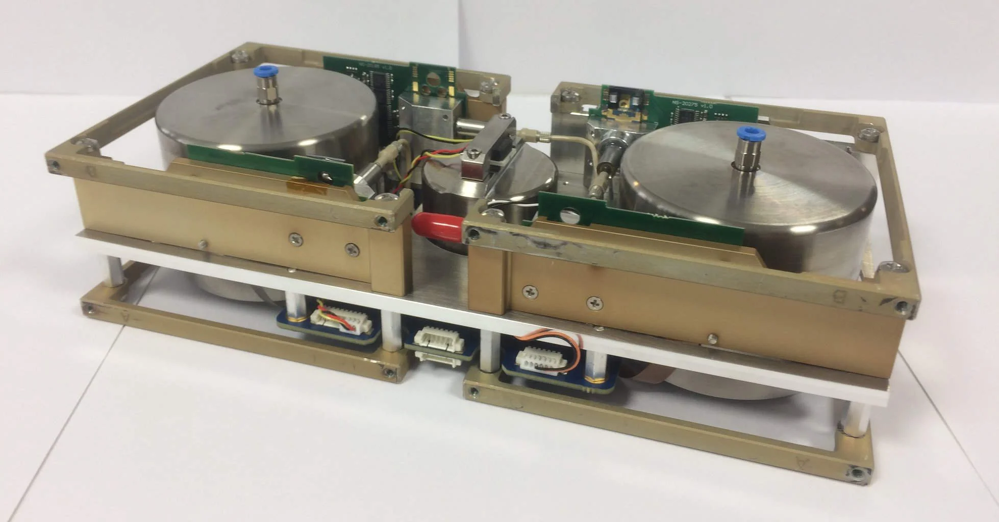 Butane cold gas thruster system used on the GomX-4B that has four 1 mN thrusters and two titanium tanks for storing butane. Takes up two half-CubeSat units in size. - Credit: Nanospace