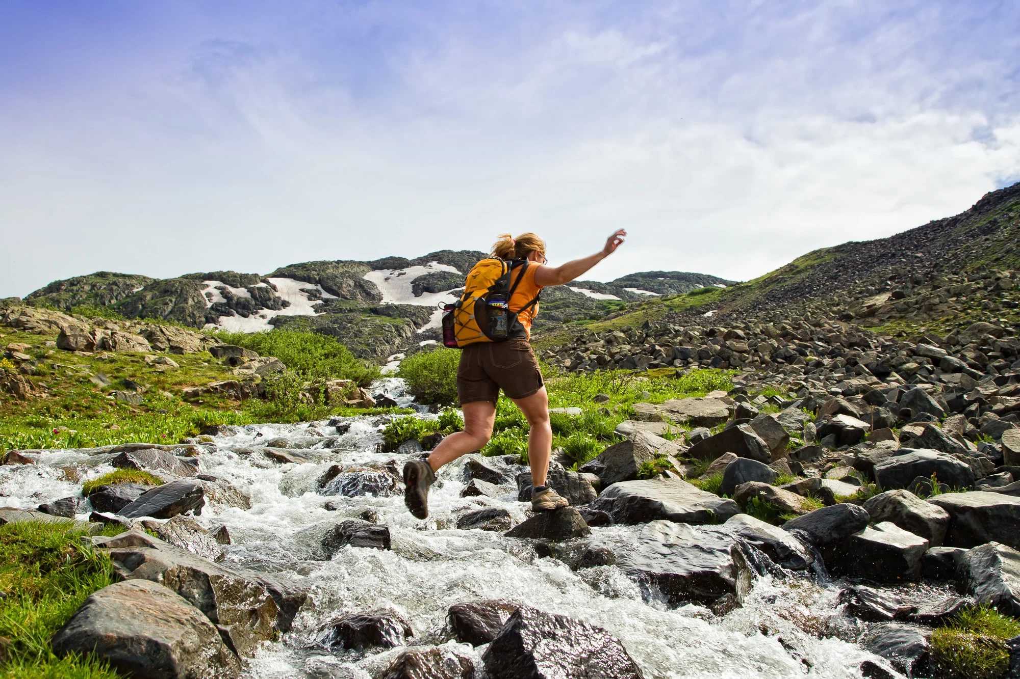Hiker Leaping Across Creek.jpg