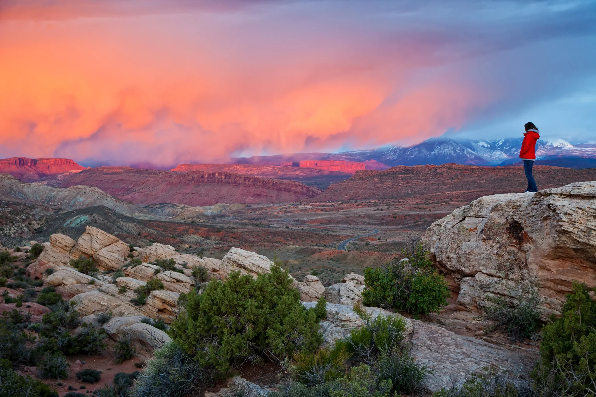 Tourist Enjoying Dramatic Sunset from near Fiery Furnace.jpg