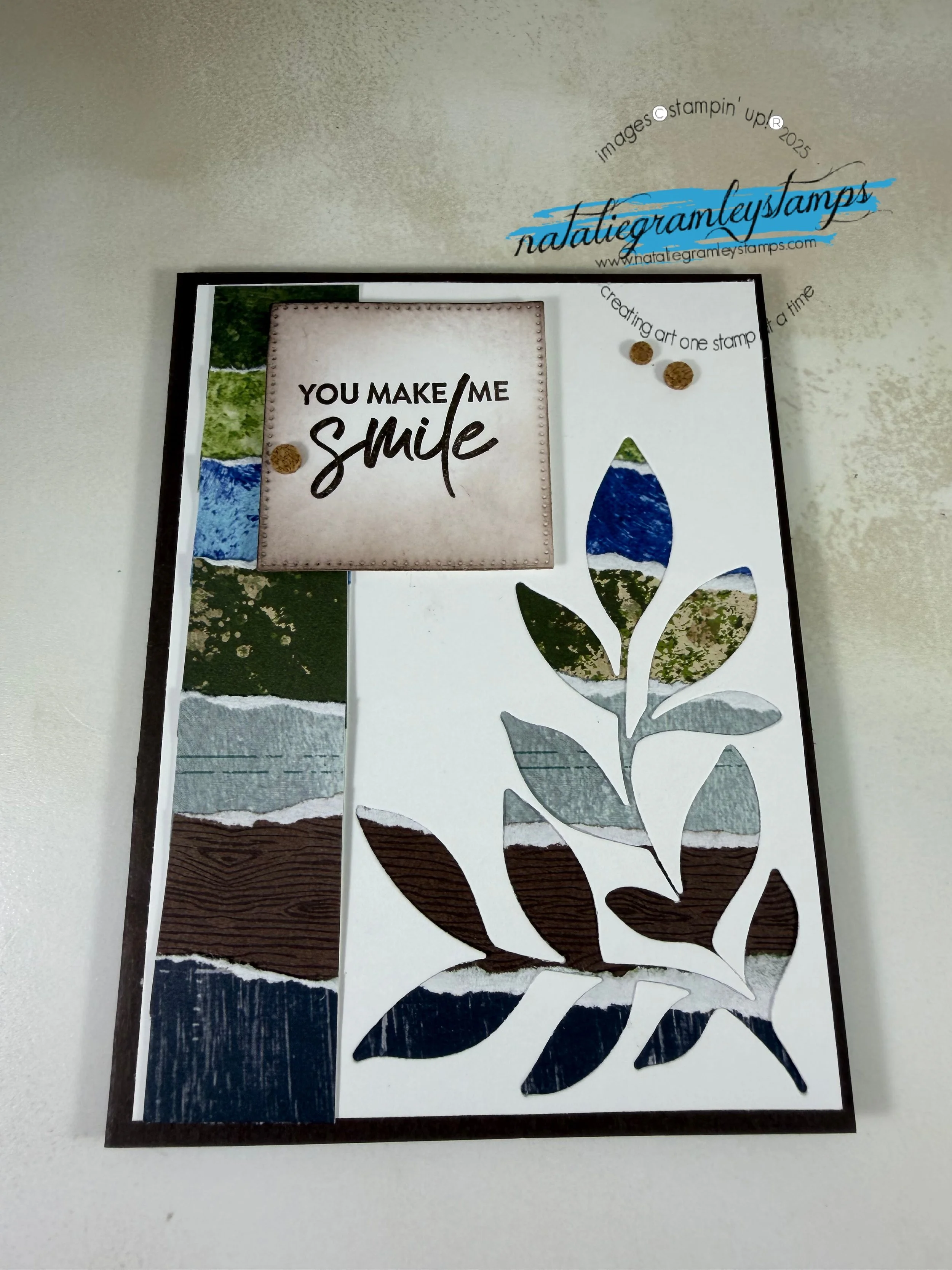 A greeting card with dark floral elements that says You make me smile
