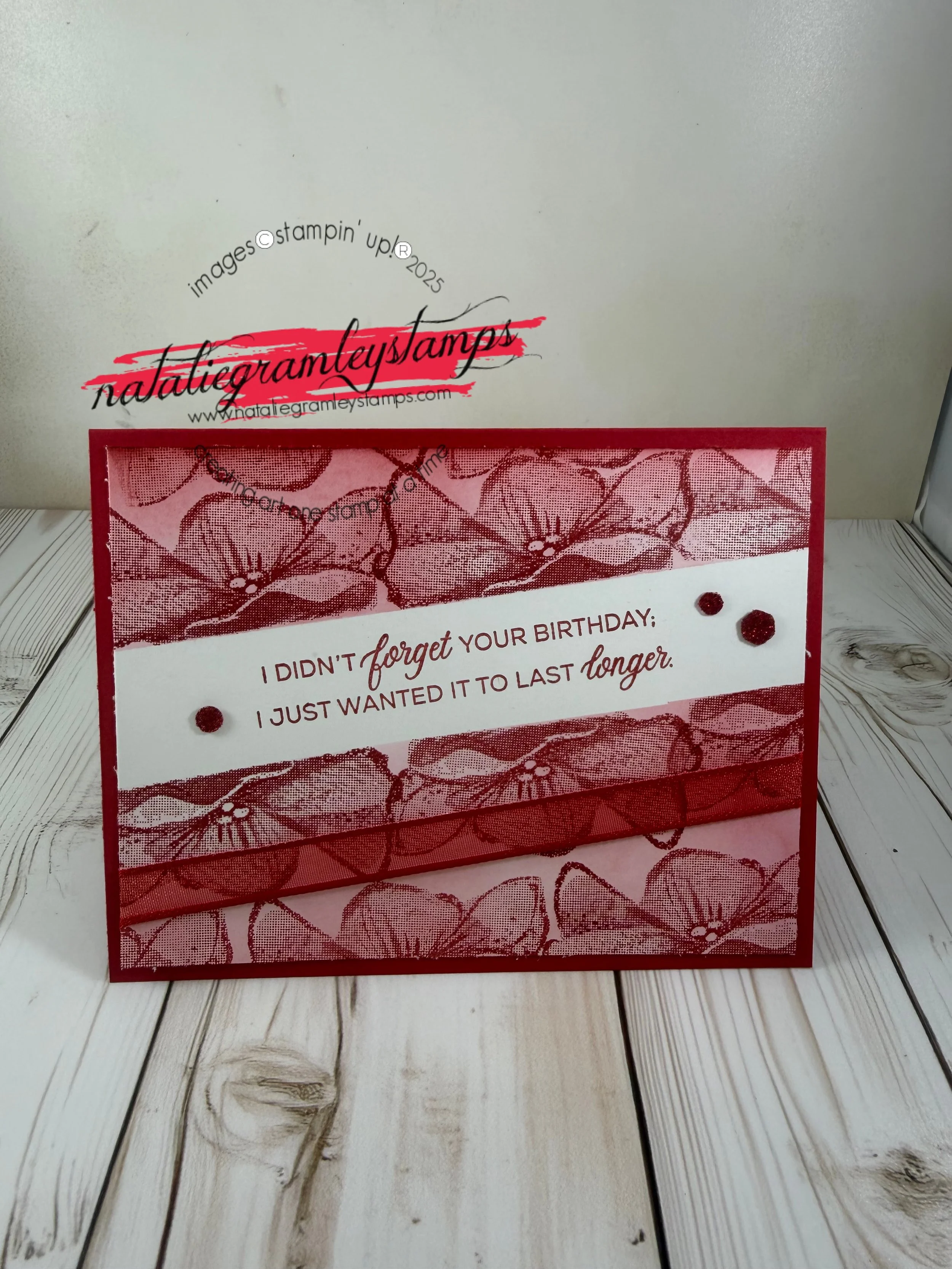 Dark red floral card reads I didn't forget your birthday; I just wanted it to last longer