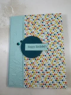 A Happy Birthday card in turquoise and multi-colored dots