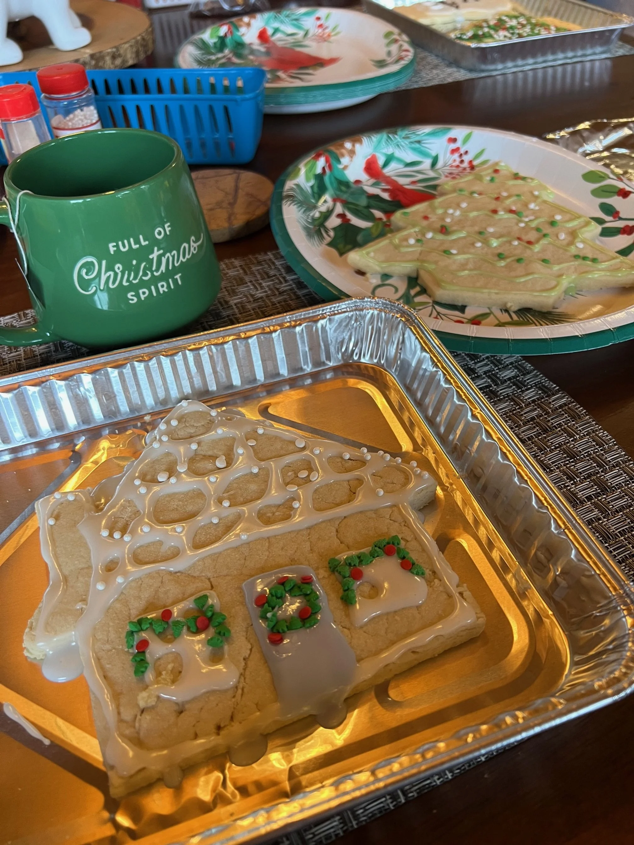 Homemade decorated Christmas cookies on a messy table