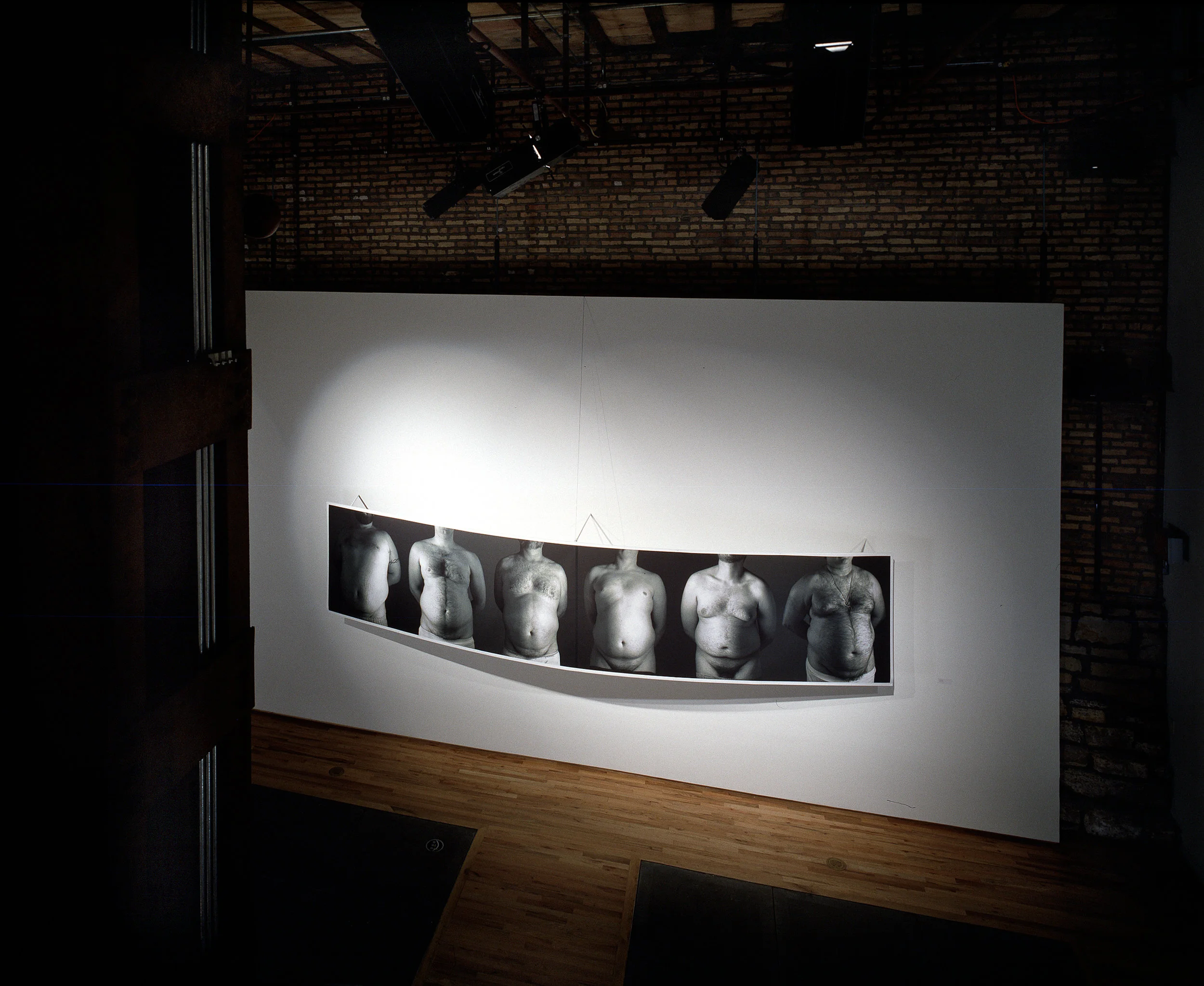installation views of Girth at Gallery 312, installation incorporates a 36” curve from the center of the print, 2001