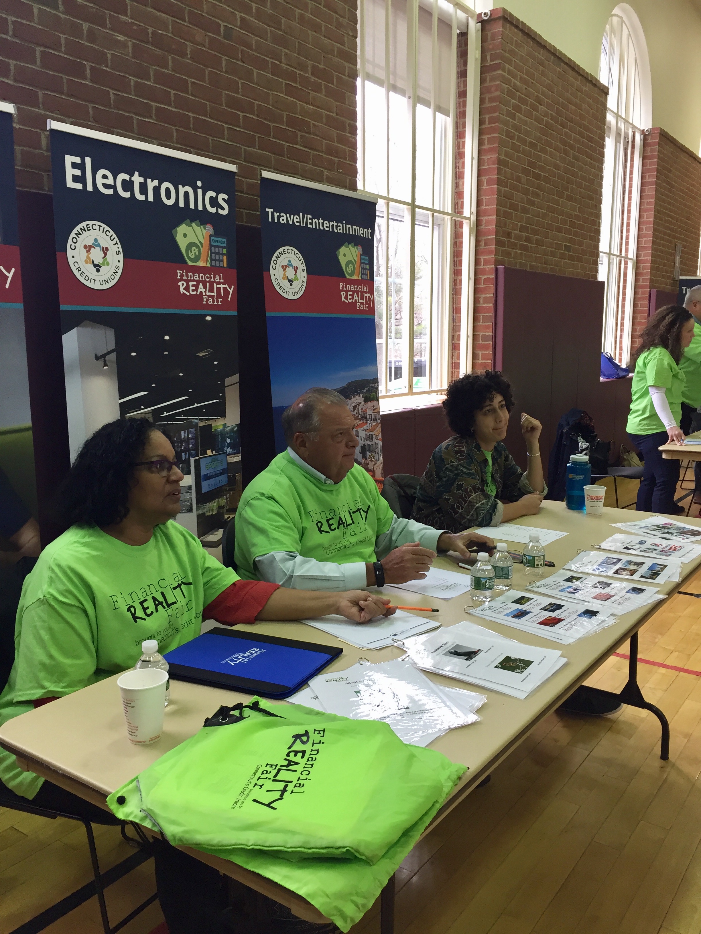 Volunteers at a booth at the reality fair