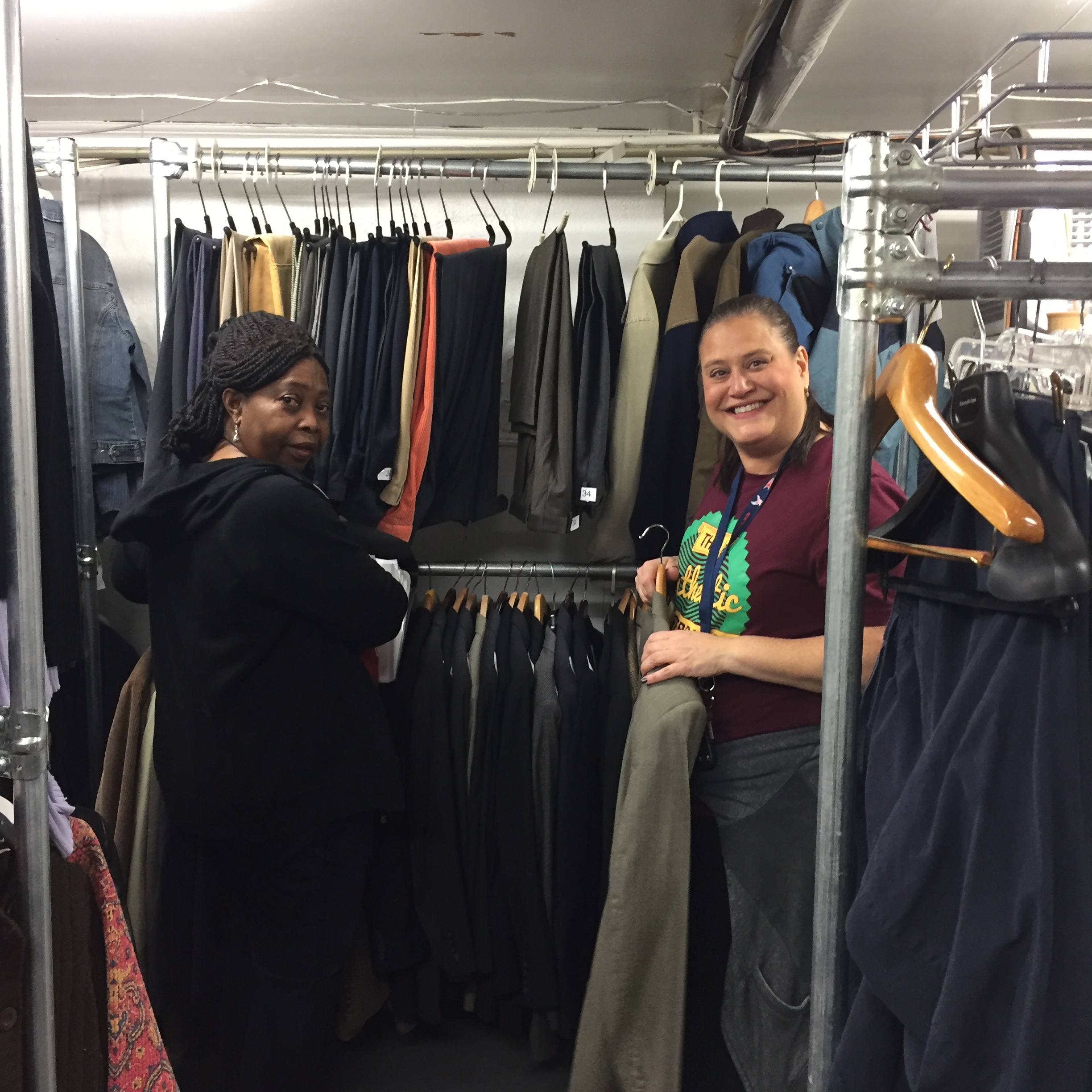 Volunteers hanging up clothes