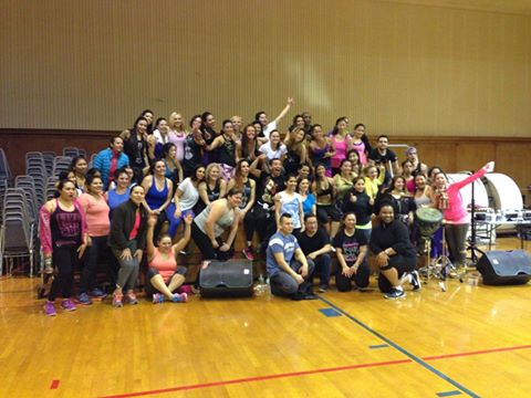 Large group of volunteers inside a gym