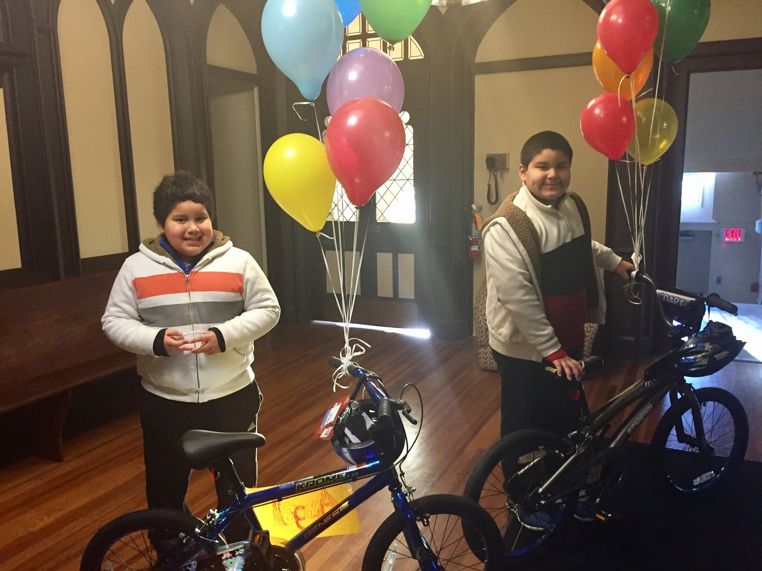 Children smiling on bikes