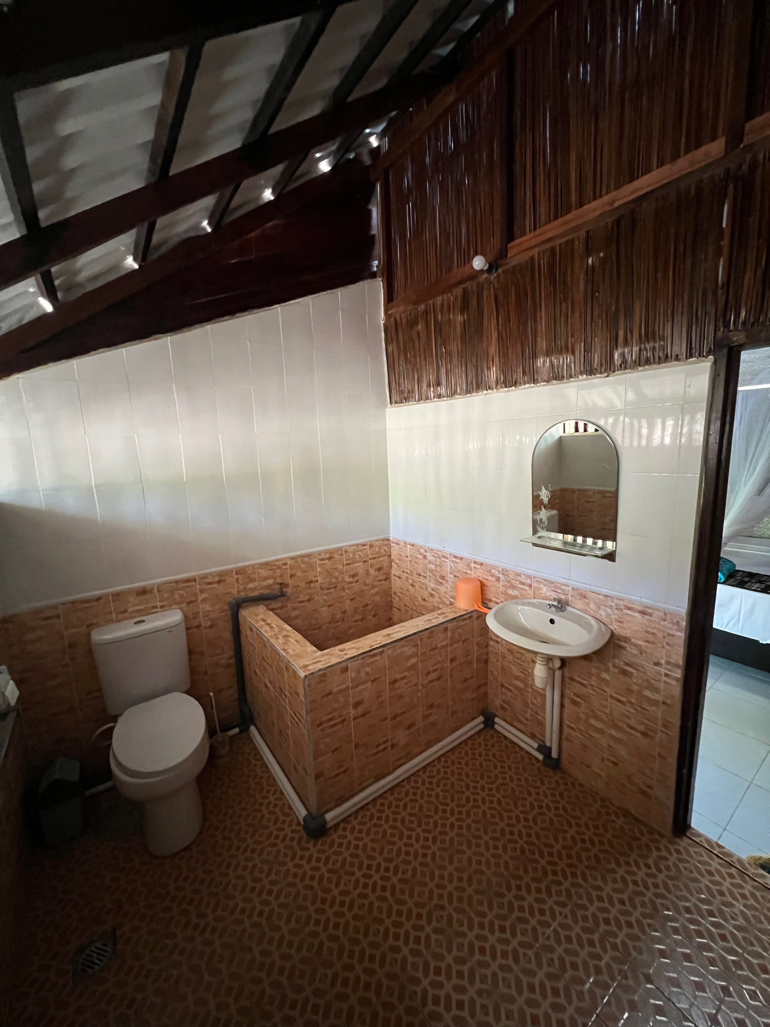  Floor to ceiling tiles, modern toilet, wash basin, low pressure shower head and Indonesian buk in every bungalow.  
