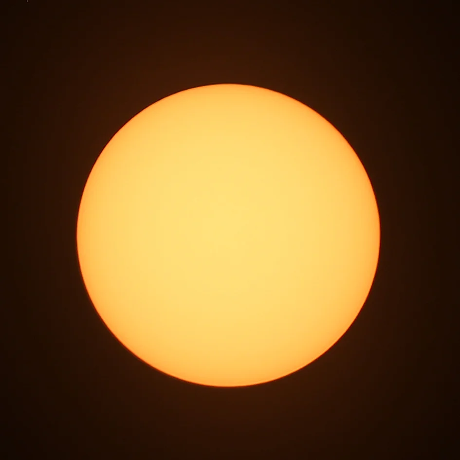 Tripod-mounted Canon 6D with solar filter at 300 mm, ISO 100, 1/13th sec @ f/6.3.