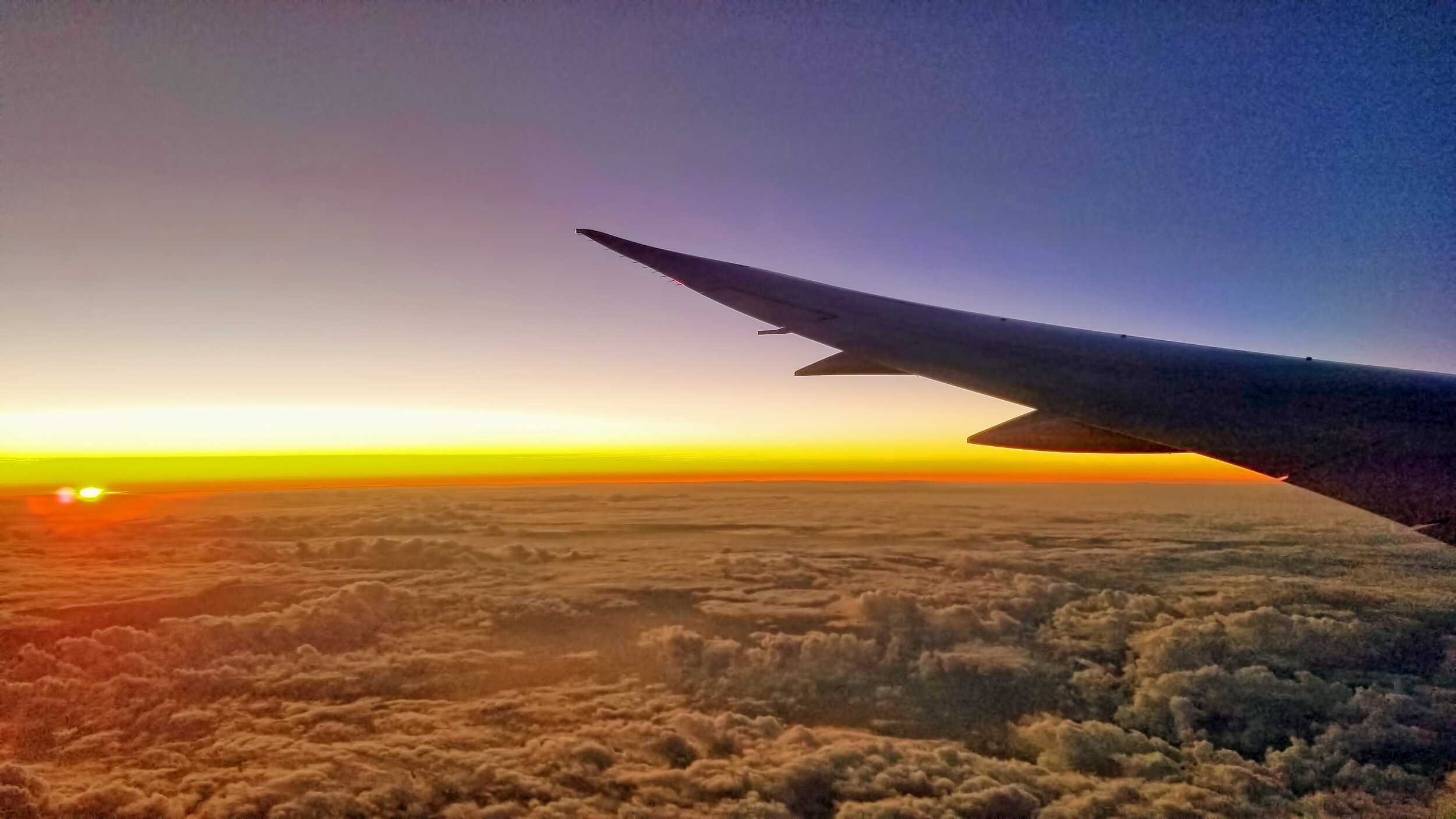 Sun rise across the International Date Line on approach to Brisbane, Australia.