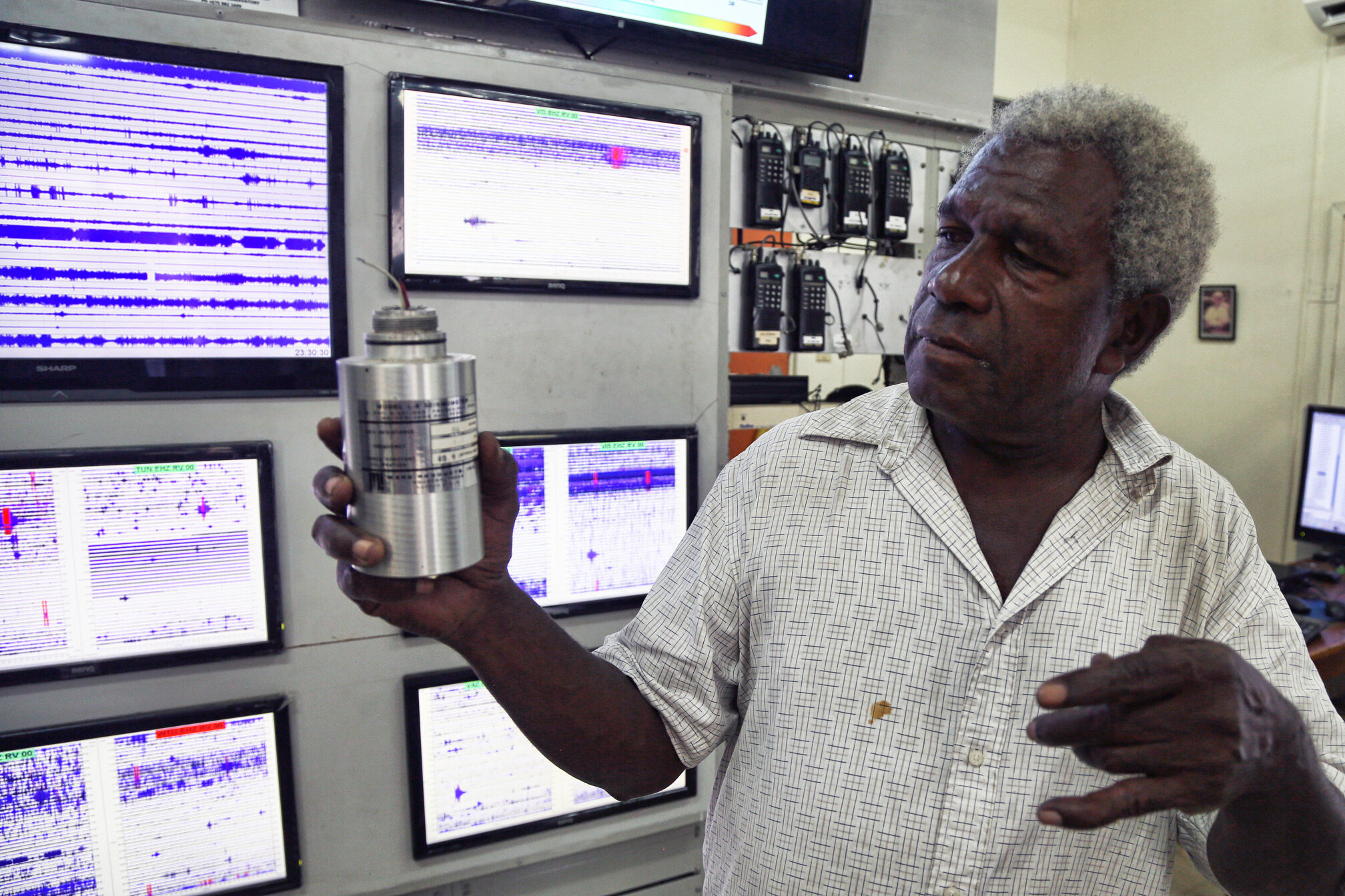 A staff member of the well-equipped Rabaul Volcano Observatory holds a modern seismometer. This lab was just recently outfitted two months ago with the assistance of the USGS and VDAP.