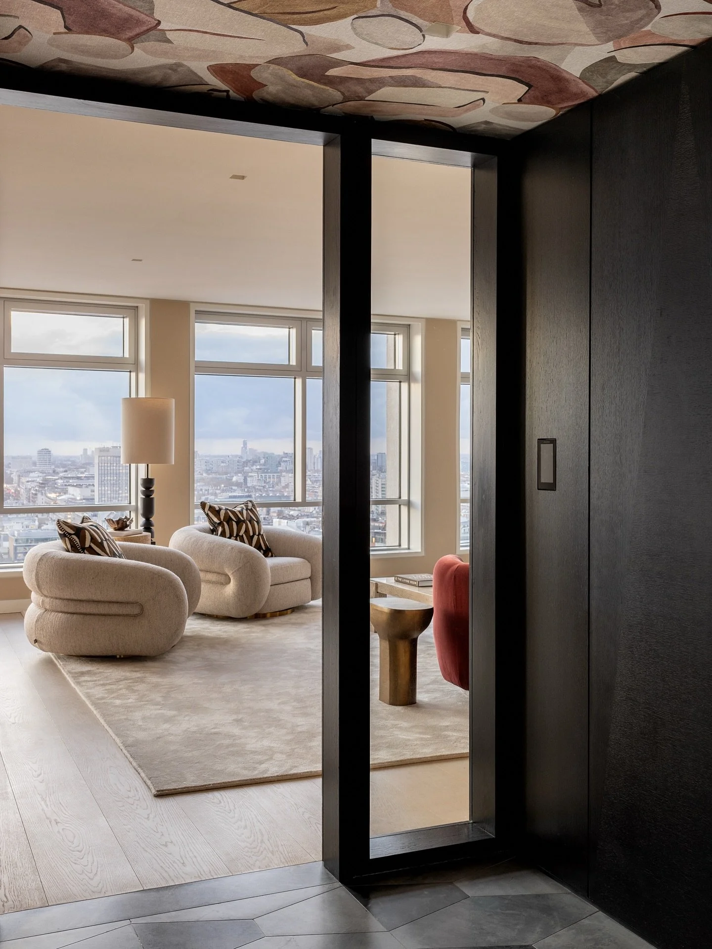New York state of mind. London address. 🗽🏙️

A.LONDON&rsquo;s latest private client project at Centre Point brings penthouse energy to the heart of the West End. Think bold wallpapered ceilings, a claret velvet sofa designed by our studio, sculptur