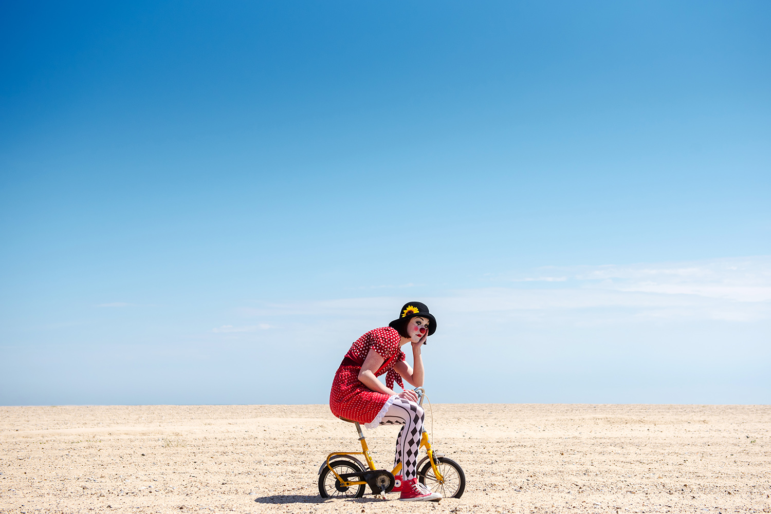 jma-photography-clown-on-bike-beach.jpg