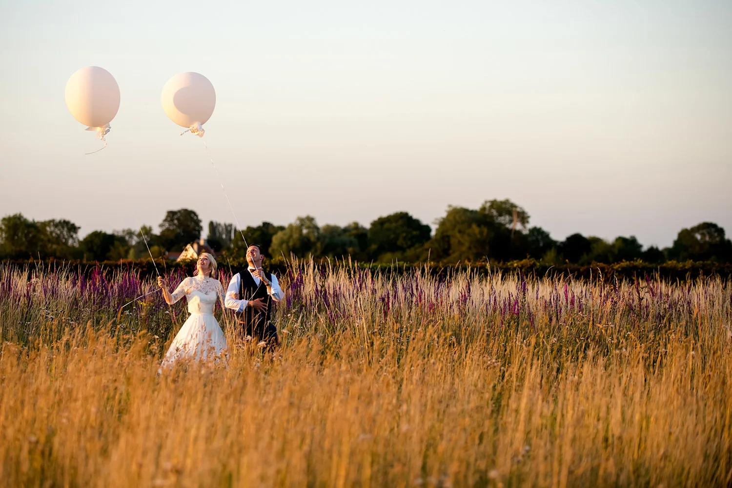 JMA-photography-bride-groom-carrying-big-balloons.jpg